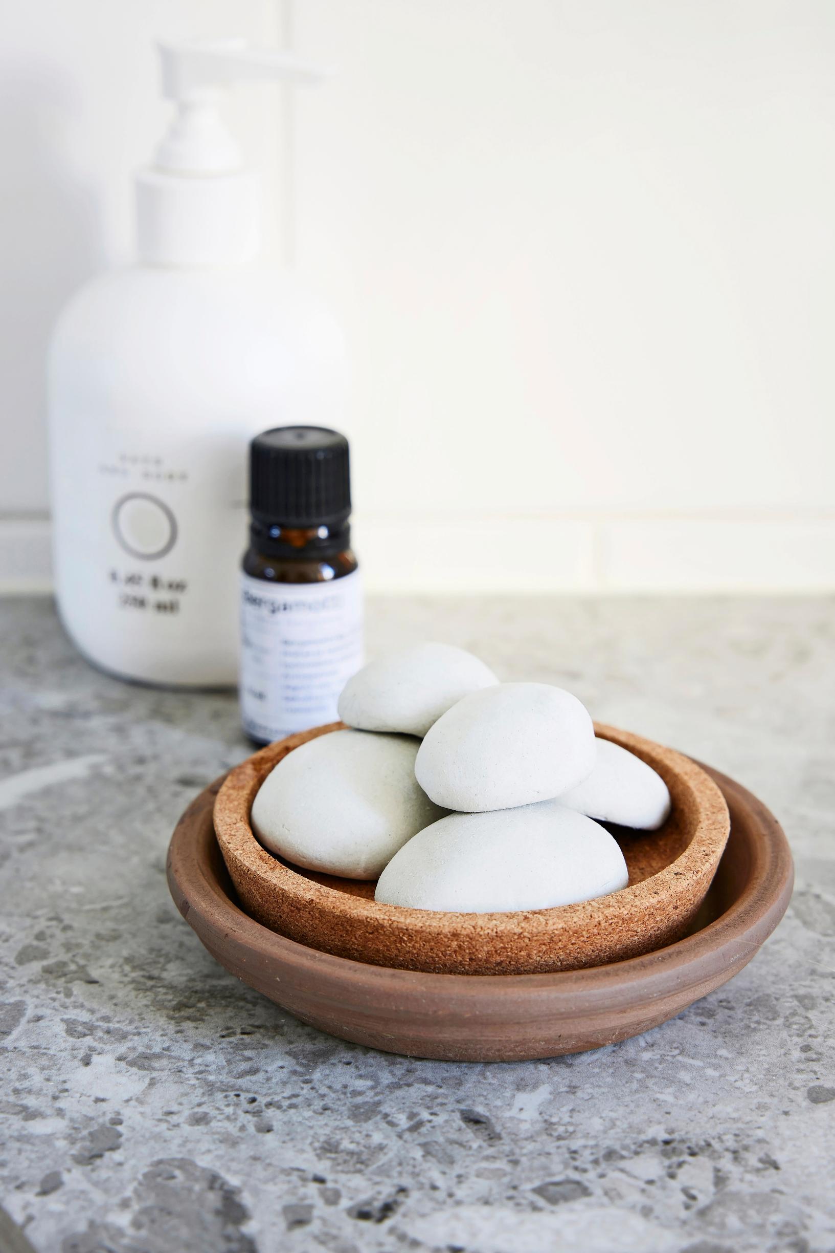 Diy bathroom refresh: ceramic scent stones on a tray