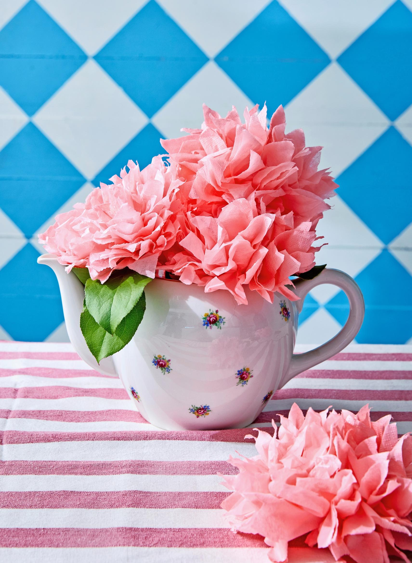 The napkin flowers are tied into a bouquet.