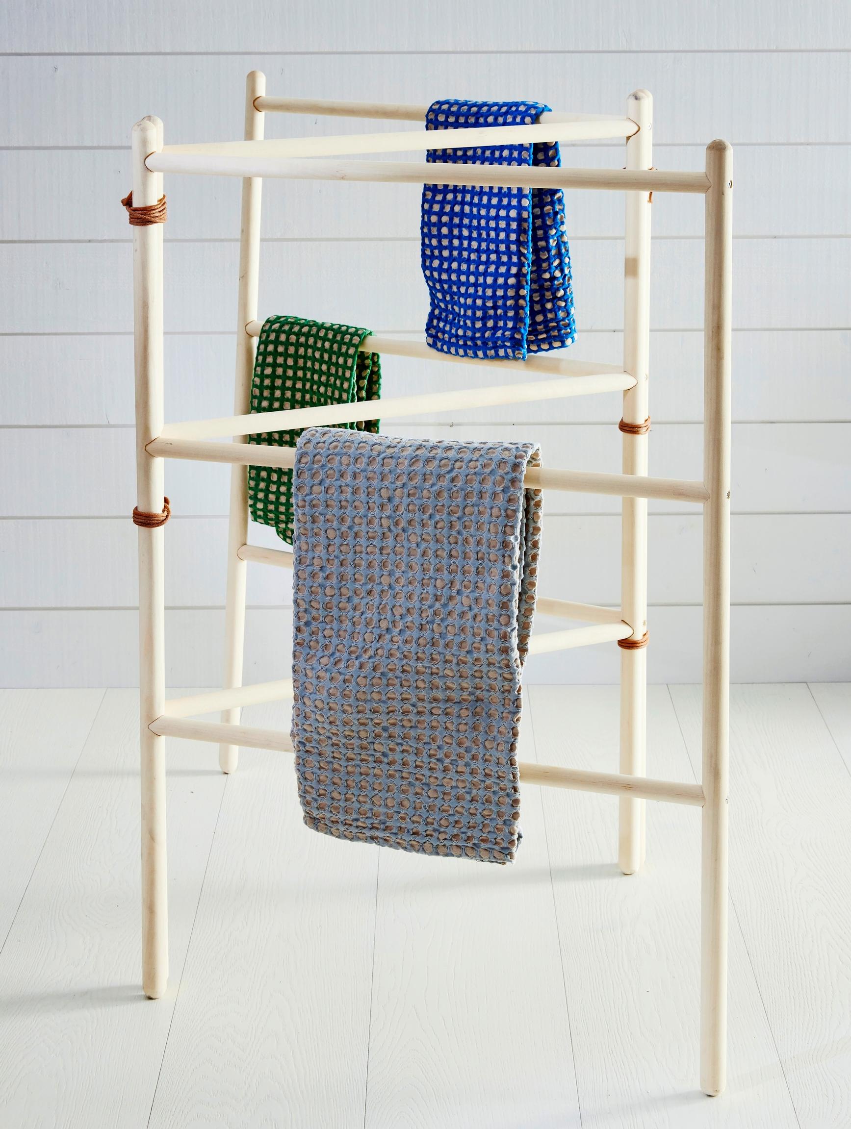Accordion-style drying rack made from broom handles