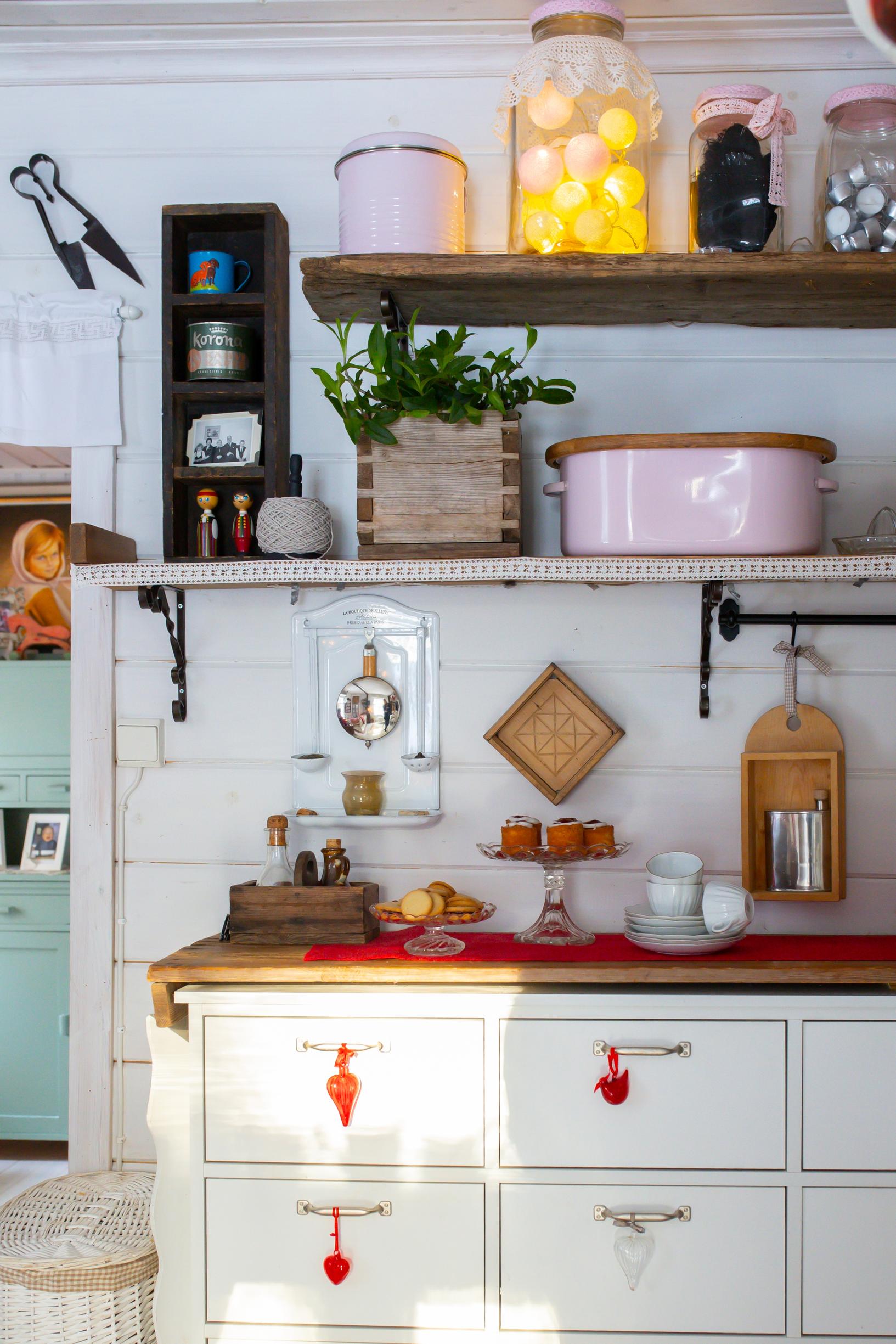 an old kitchen cabinet, a shelf, and dishes