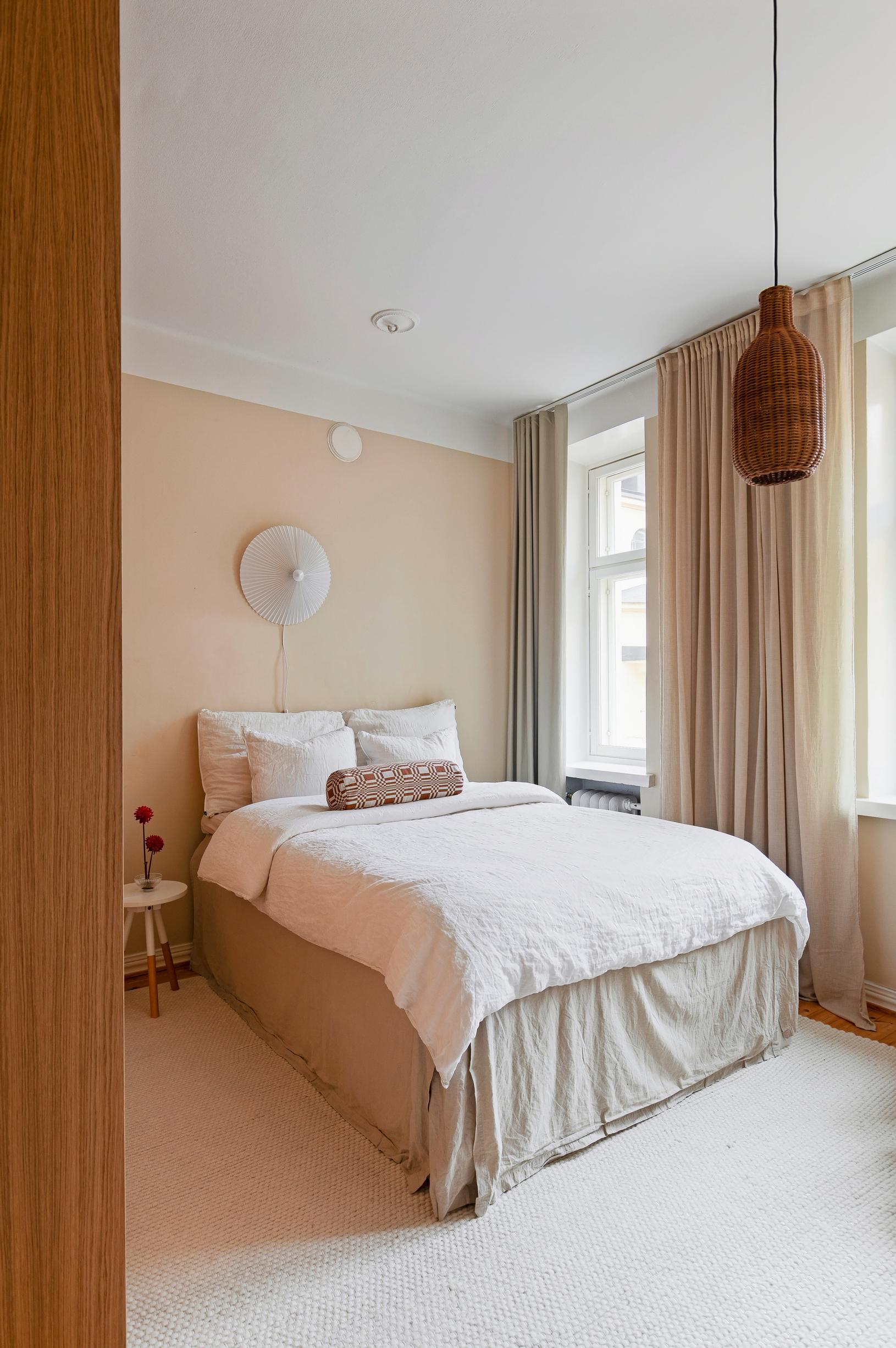 The bedroom has a cozy boutique hotel vibe with a Japanese touch.