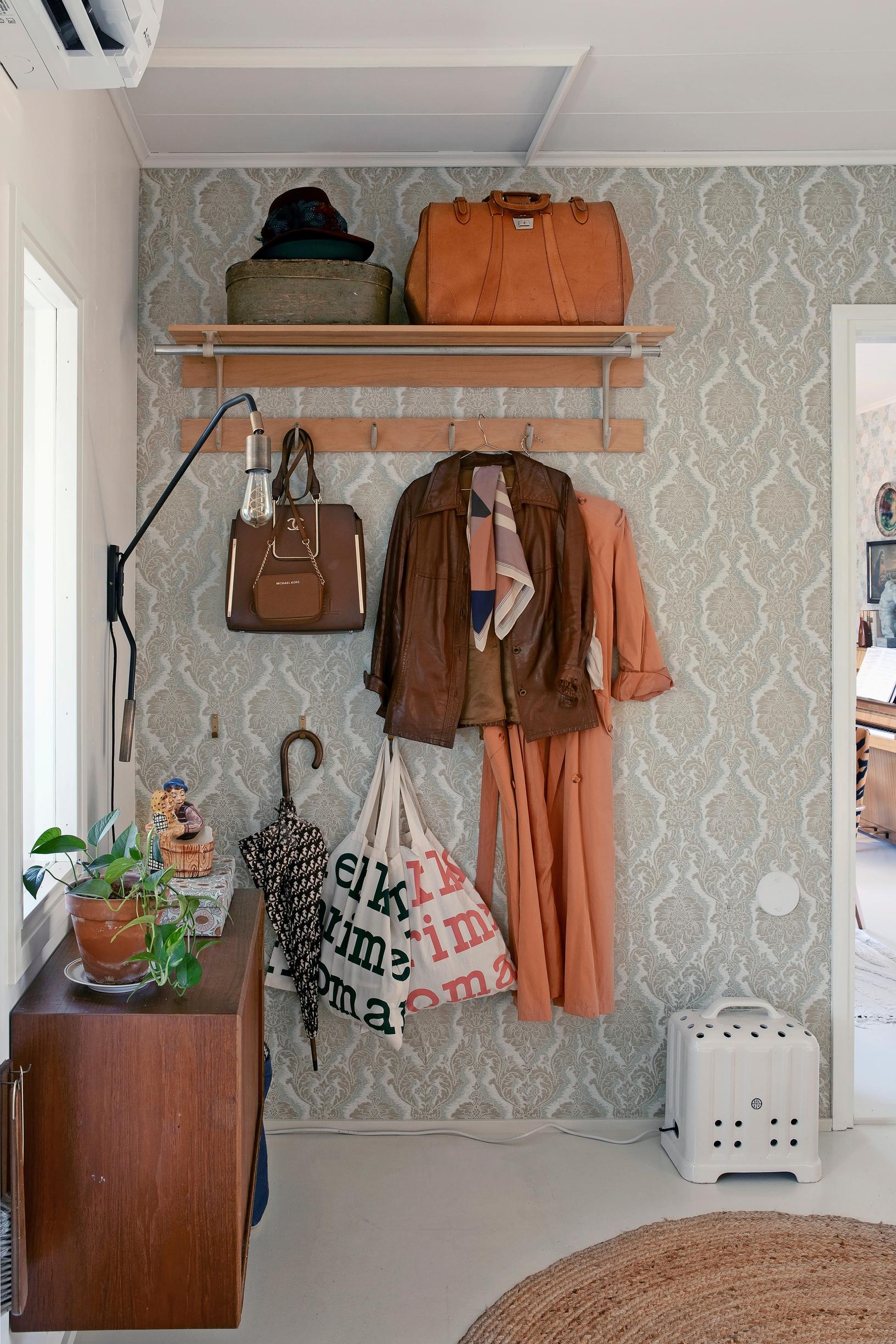 Foyer with an old Arabia heater repurposed as a lamp