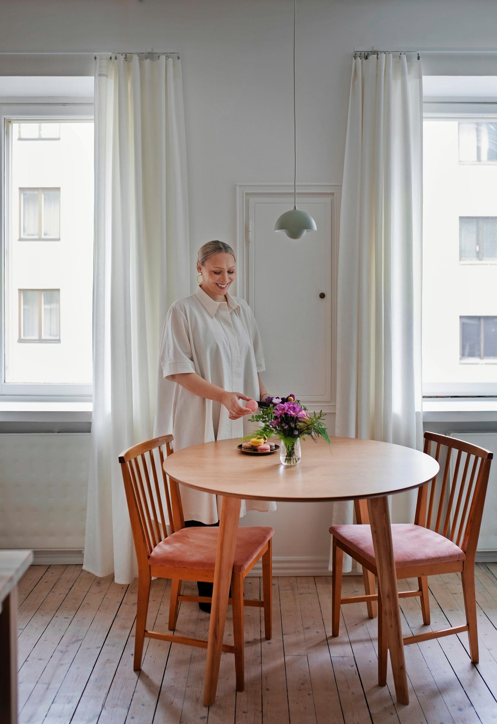 Photo of Kati Jukarainen setting the table.