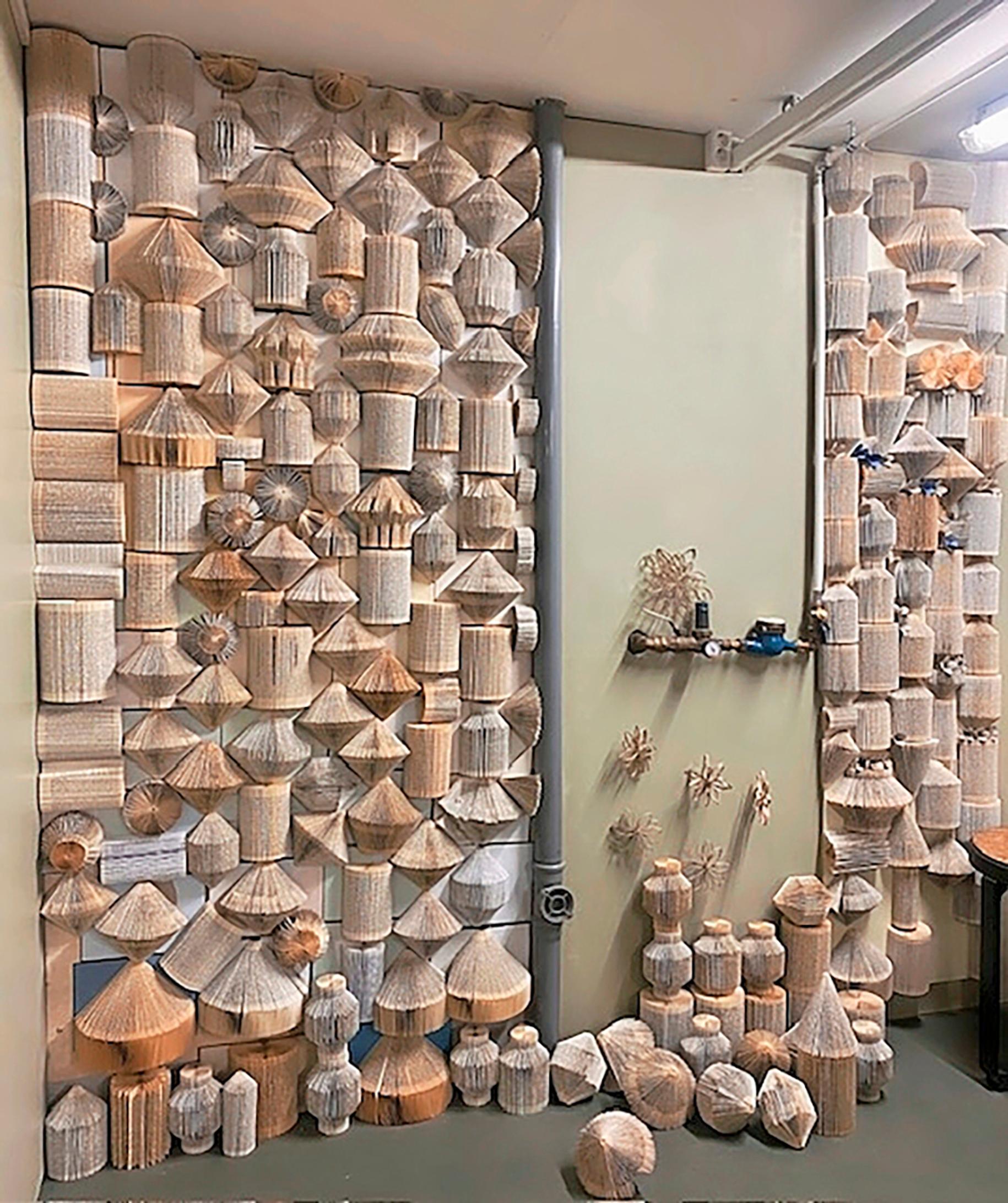 an acoustic wall made from folded books