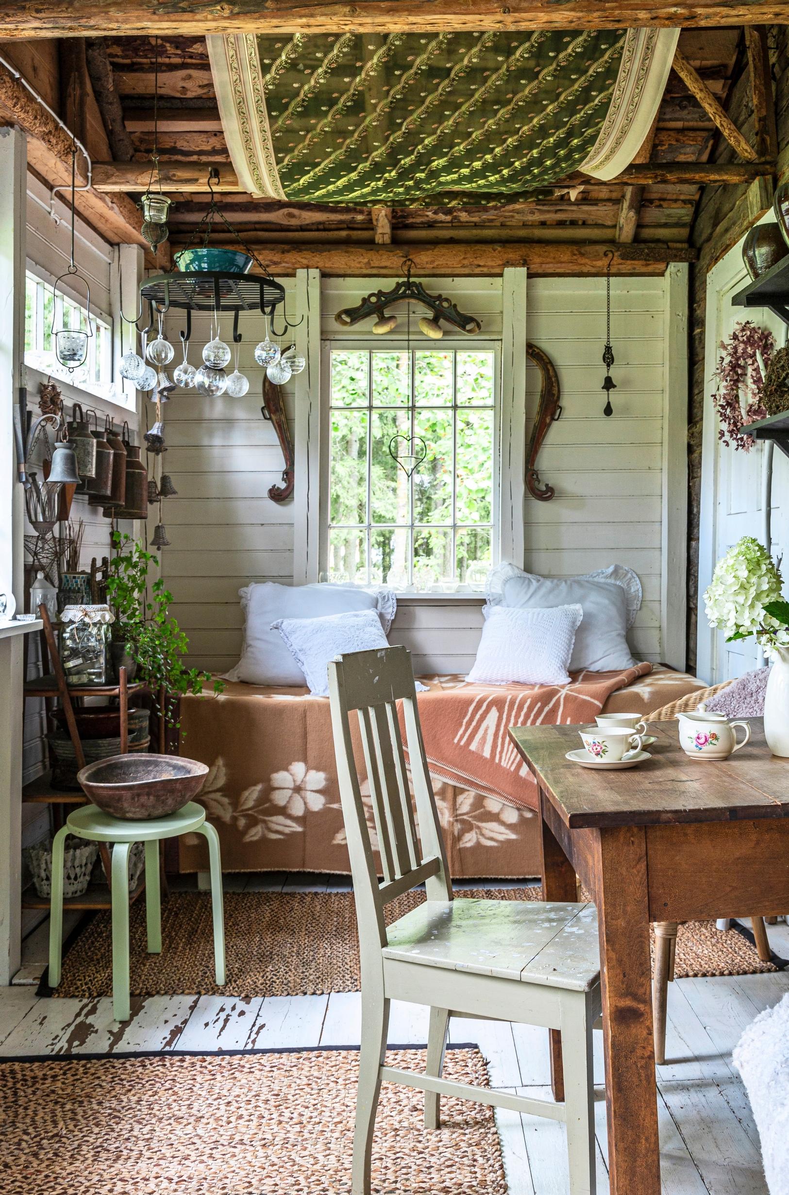 Glass porch of a 1910s log cabin