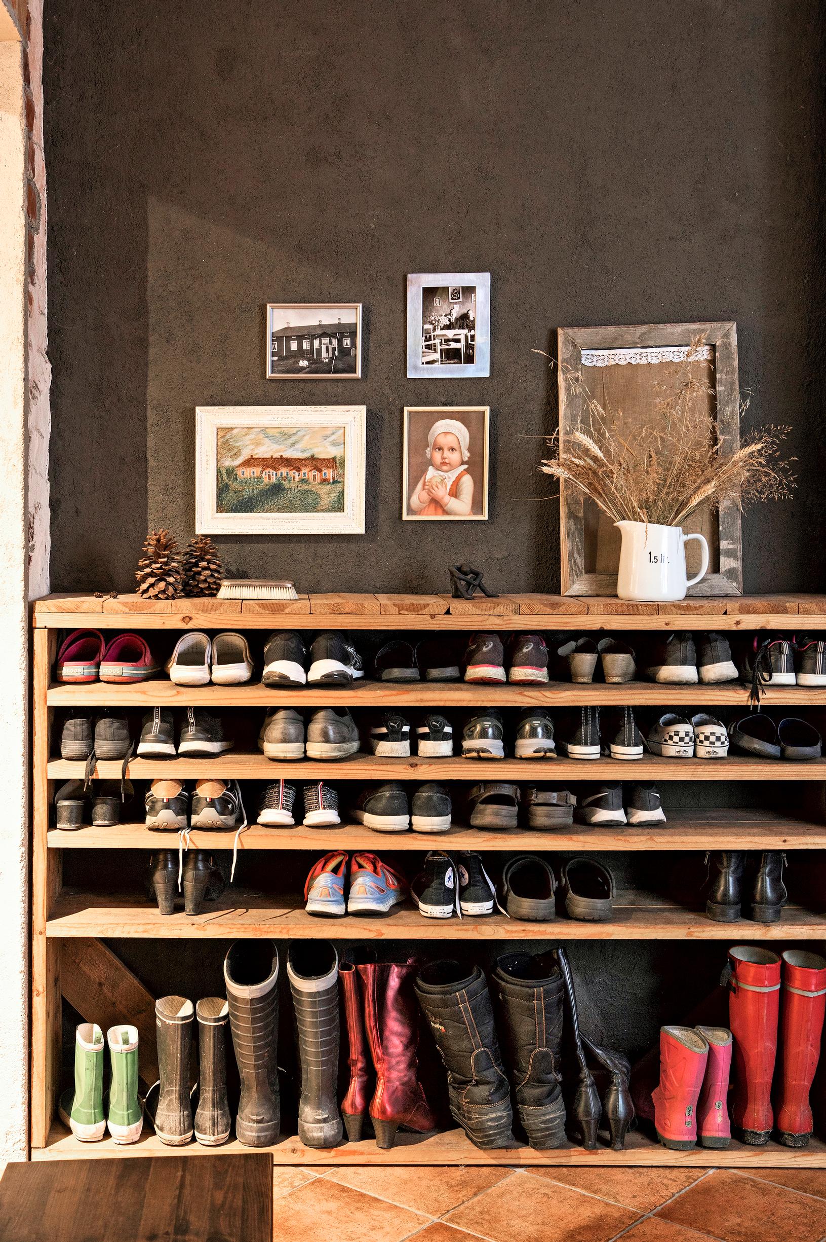 A multi-level shoe rack crafted from wooden planks