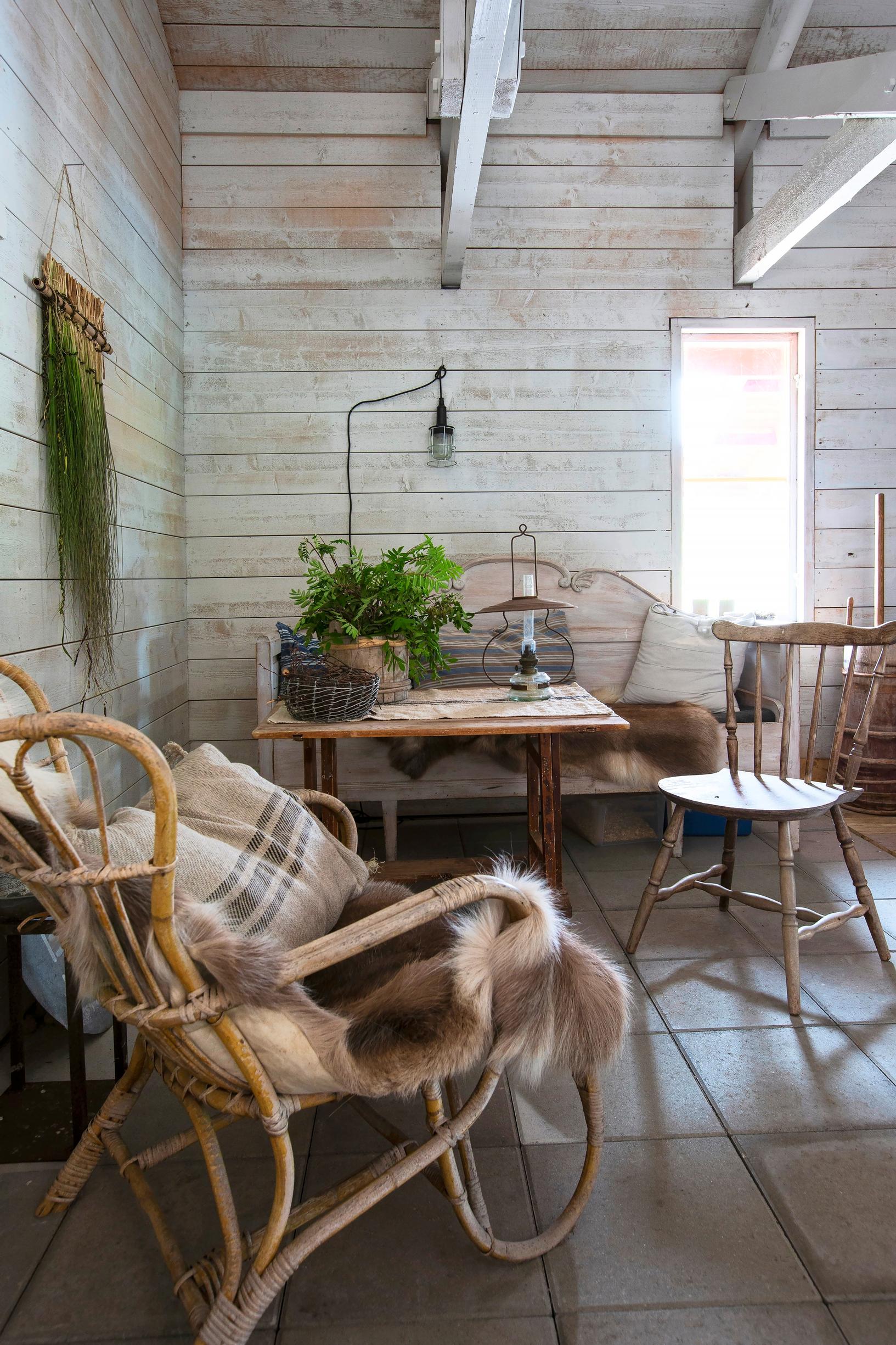 A wicker chair and vintage furniture add warmth.