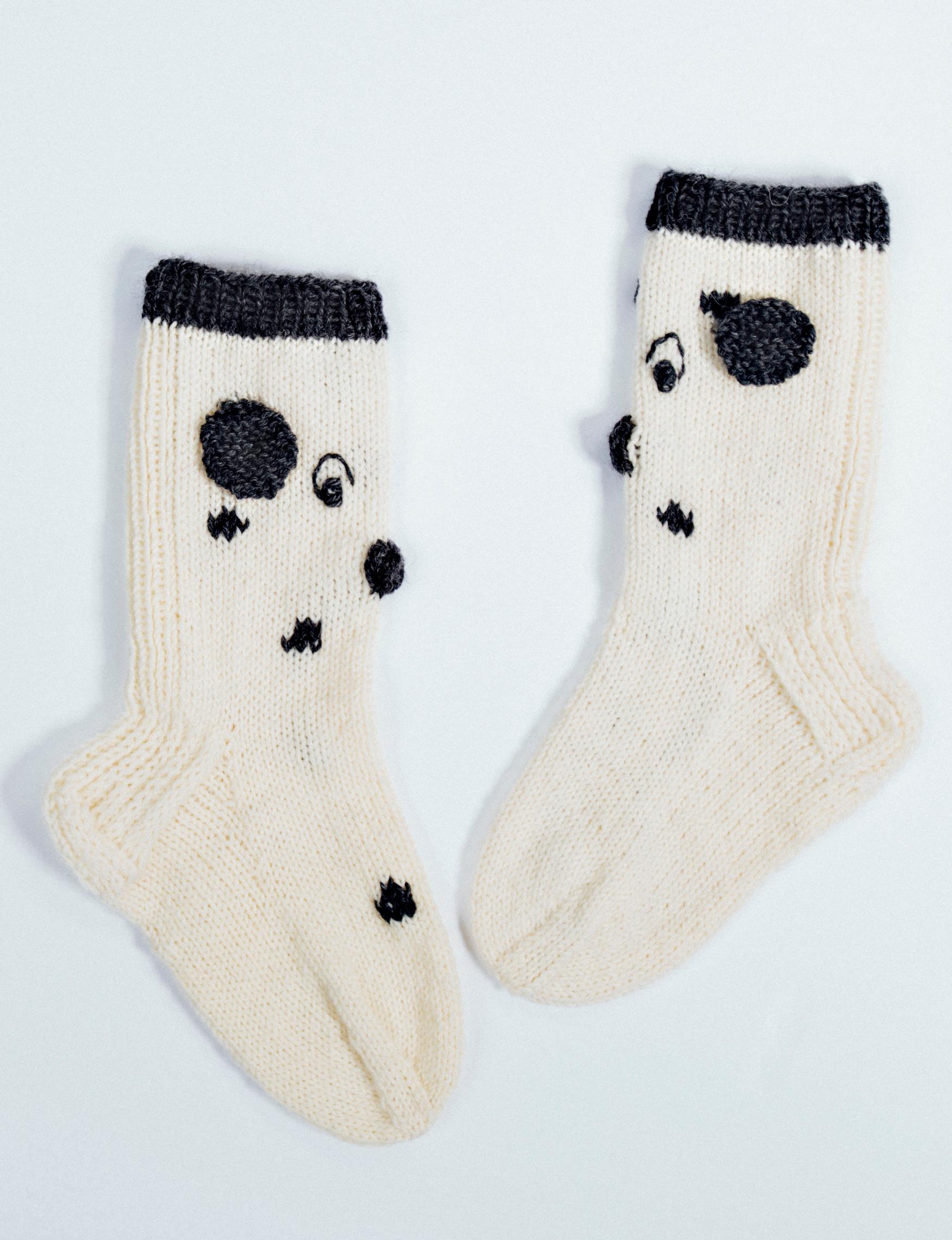 Dalmatian wool socks on a surface