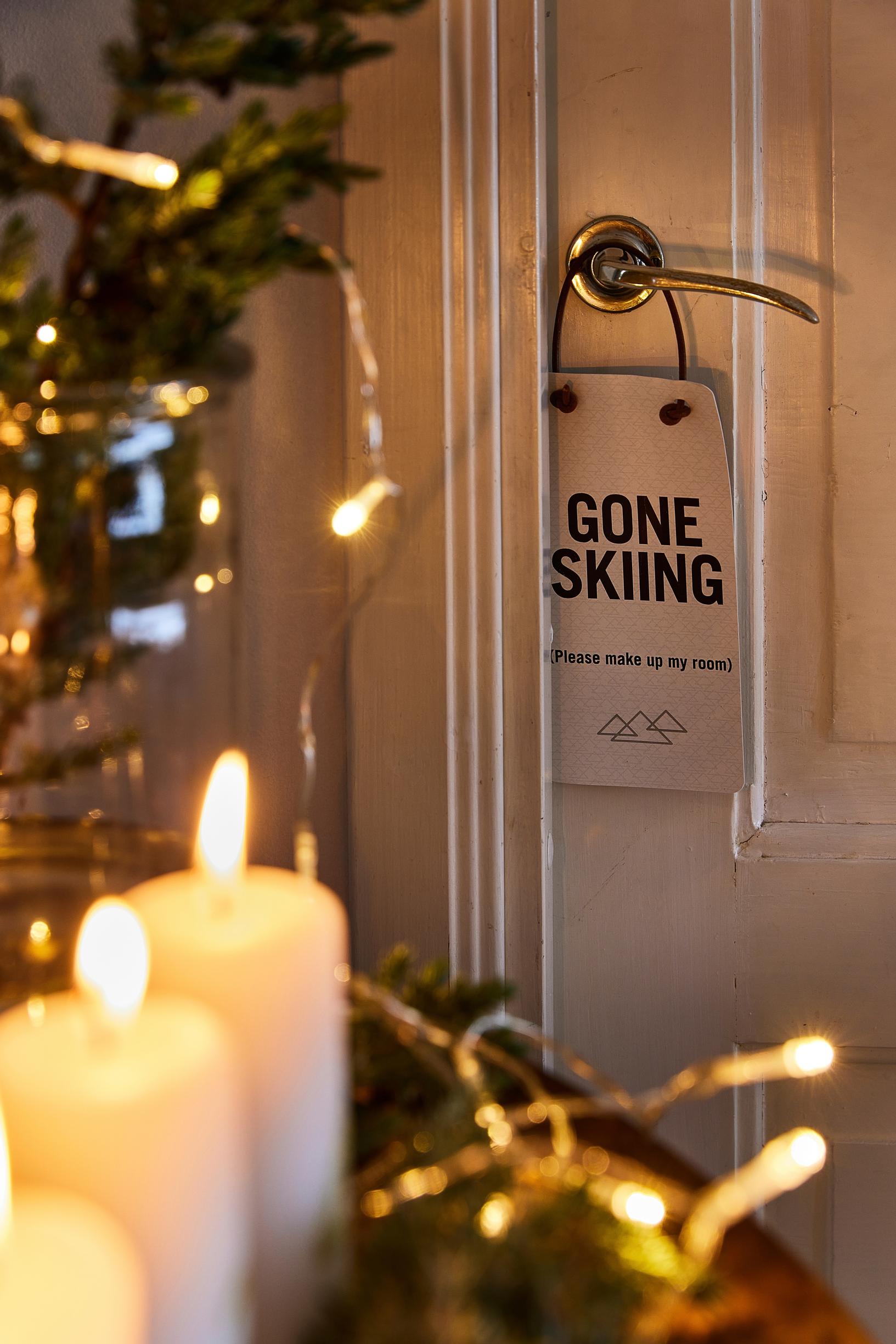 Candles and sign on the door