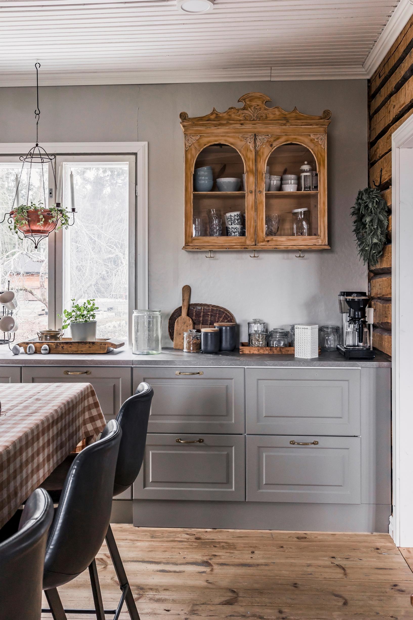 an old cabinet on the kitchen wall