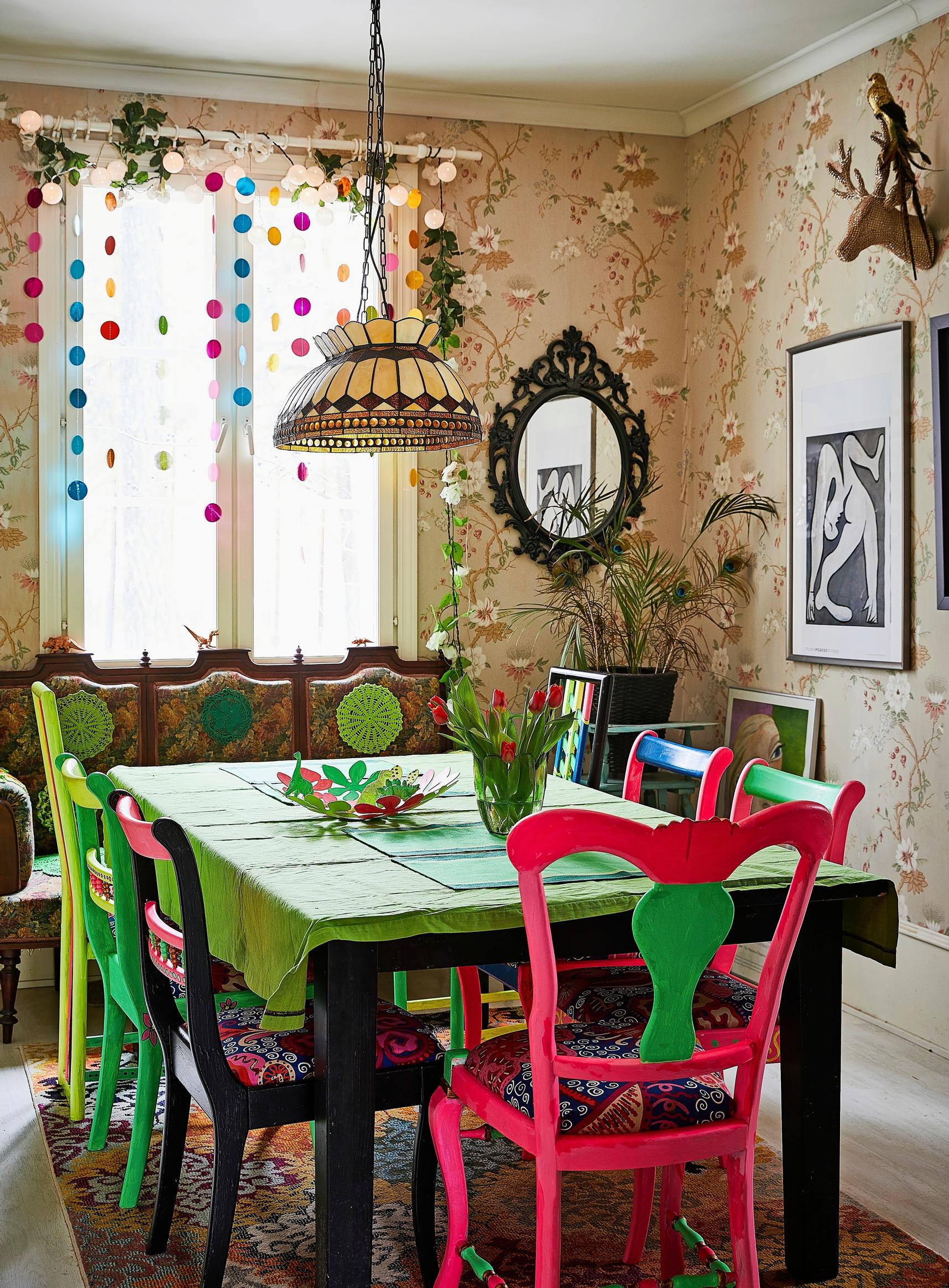 Mismatched chairs around the dining table