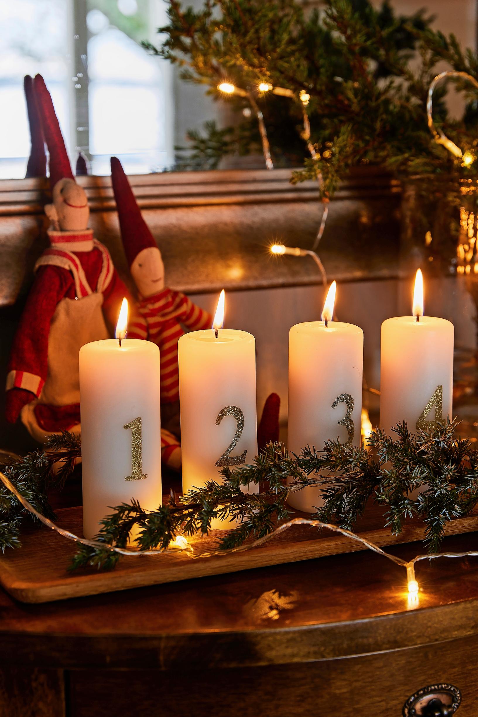 Advent candles and an elf on the tabletop
