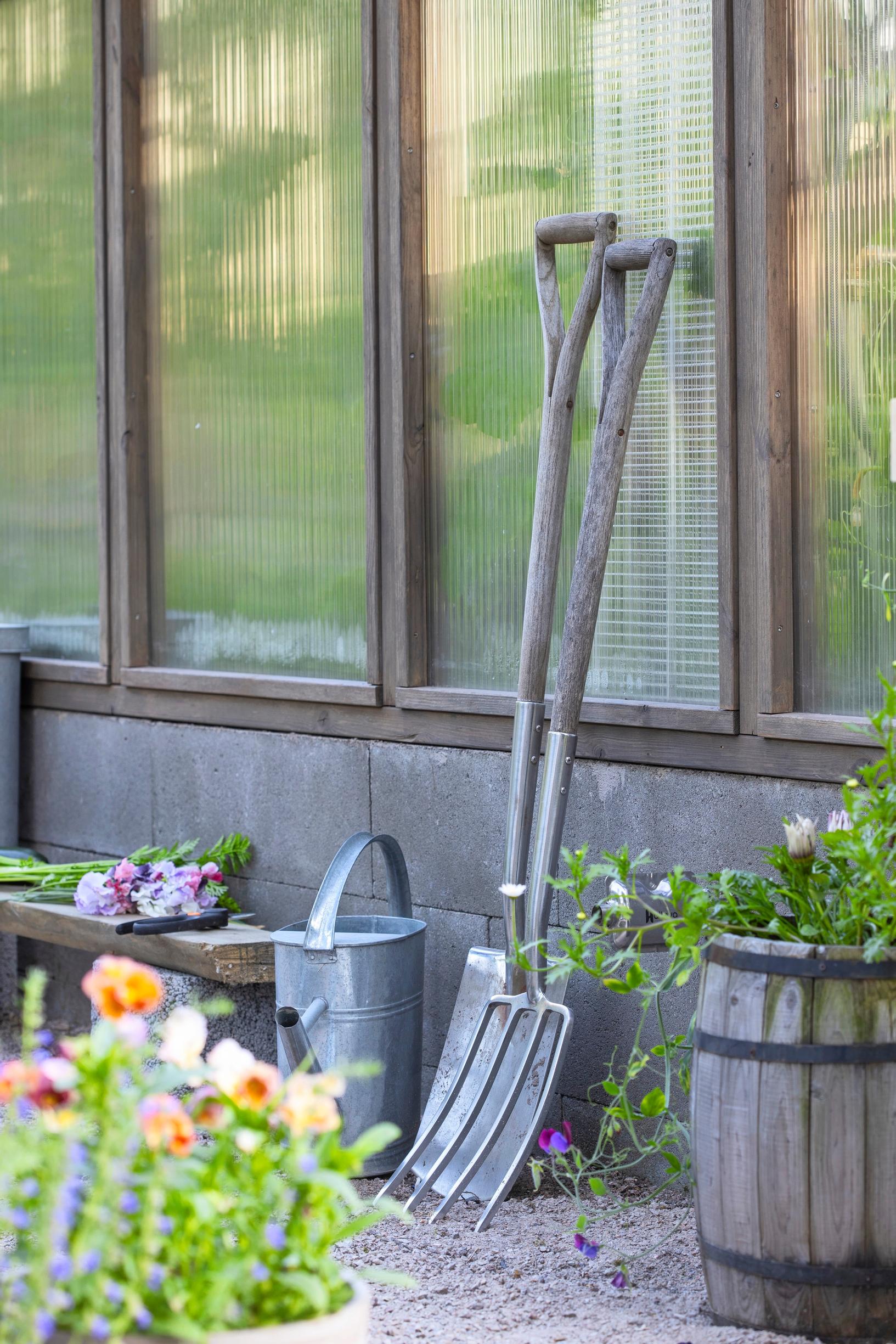 Virpi and Jani designed a wooden-framed greenhouse with polycarbonate panels.