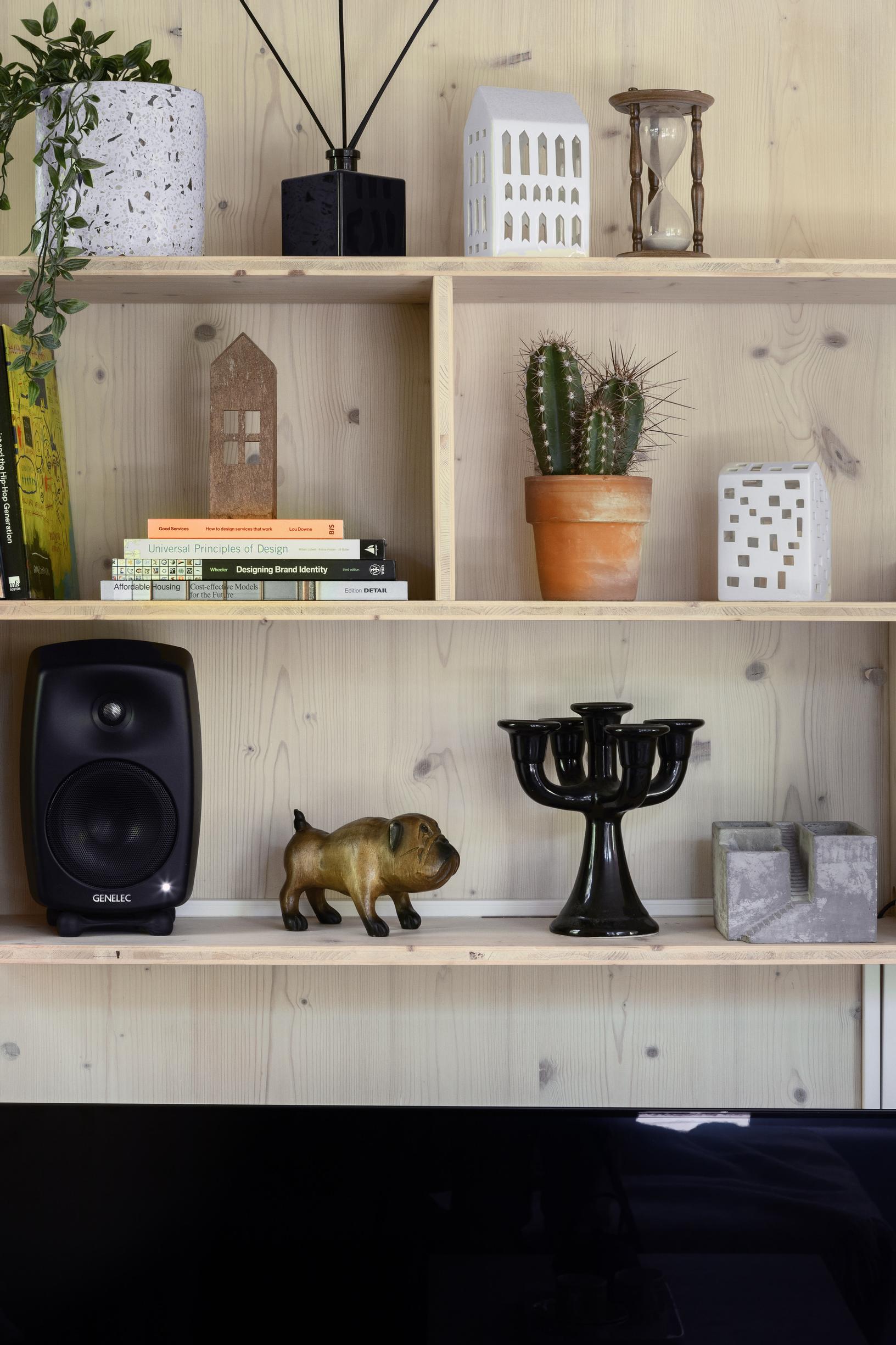 The living room’s wall shelf with decorative objects.