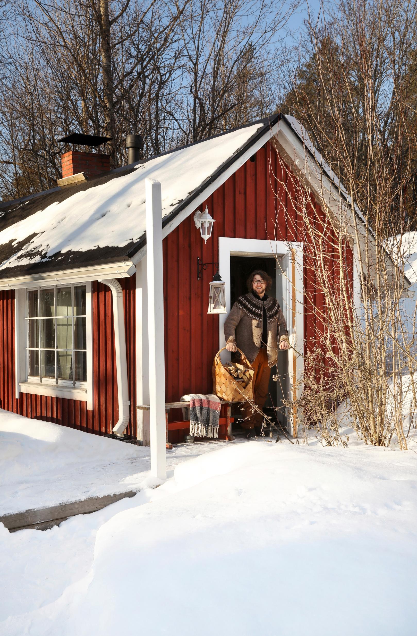 Robert Hole at the door of their garden sauna