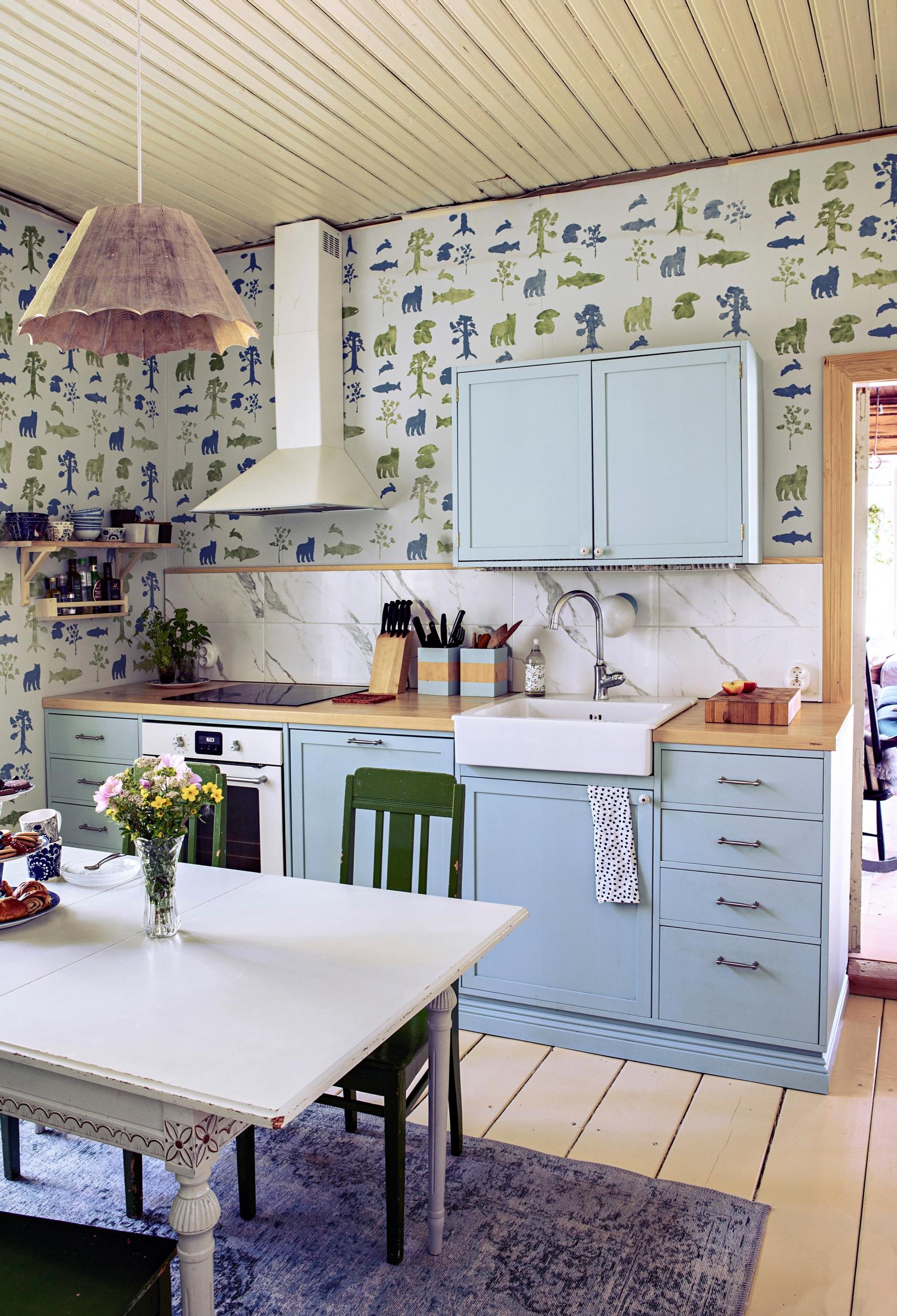 The wallpaper in the kitchen, designed and hand-printed by Mari