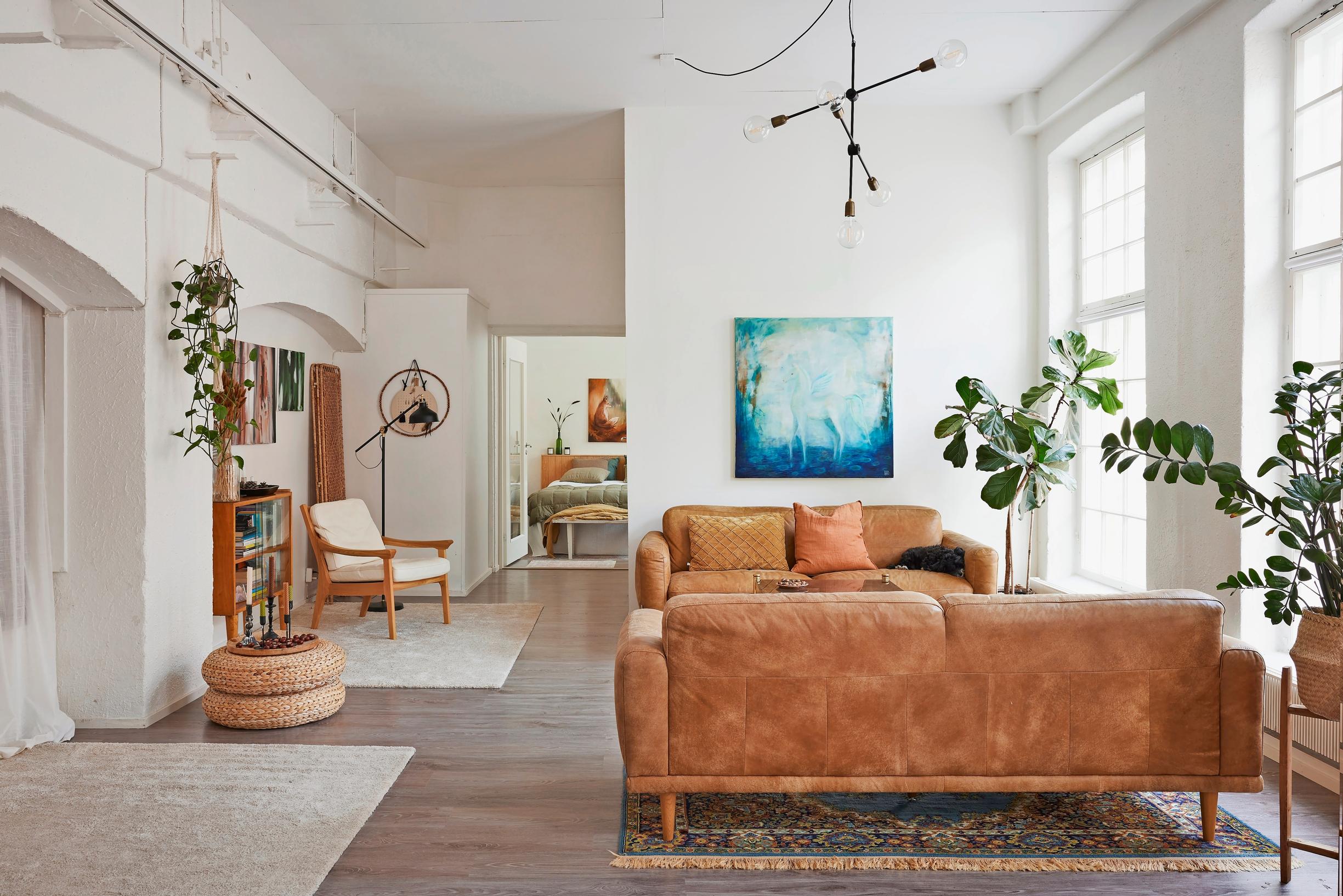 brown sofas in a large living room space