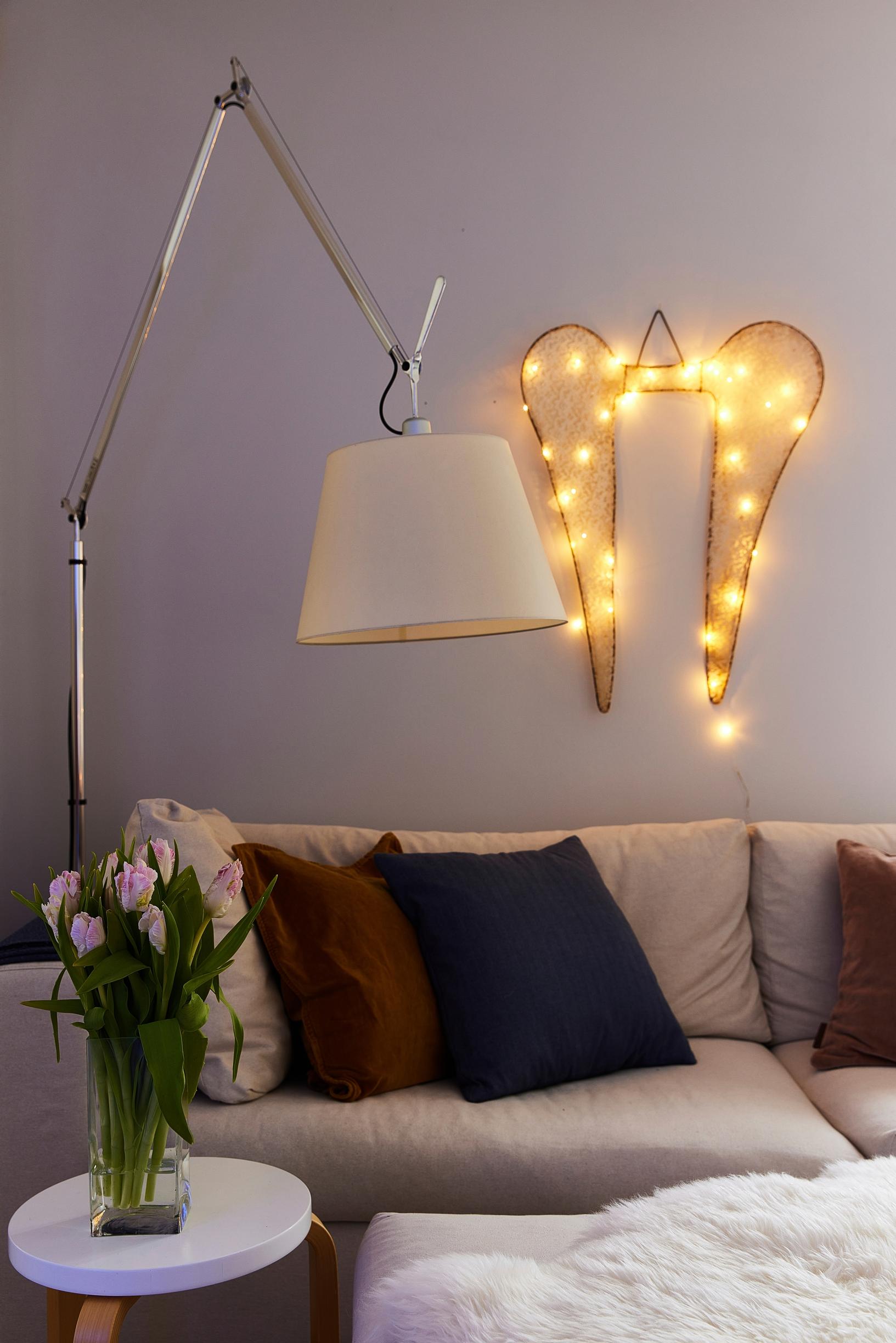 Illuminated wings on the wall