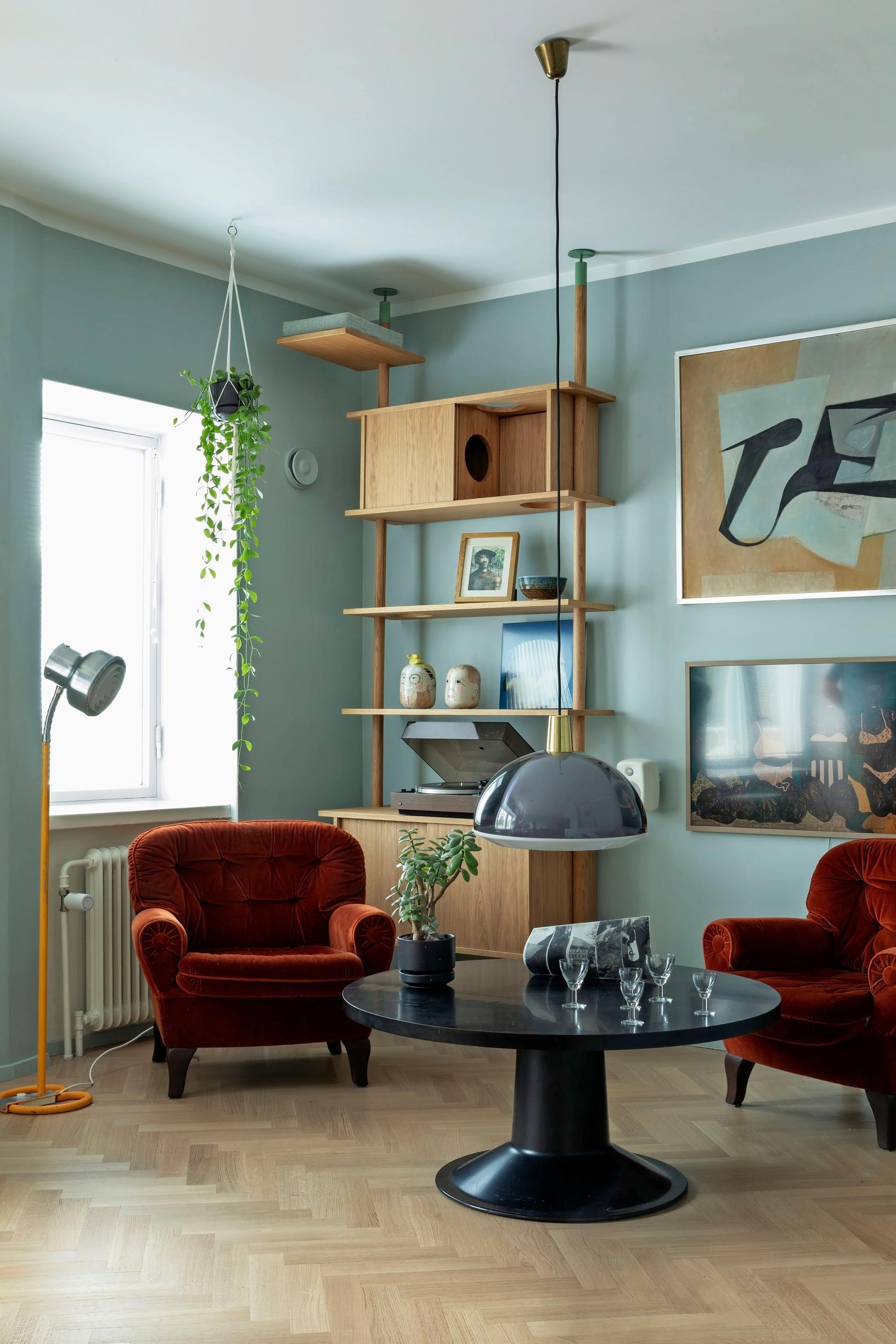 The living room with a lounge vibe and a cat climbing structure