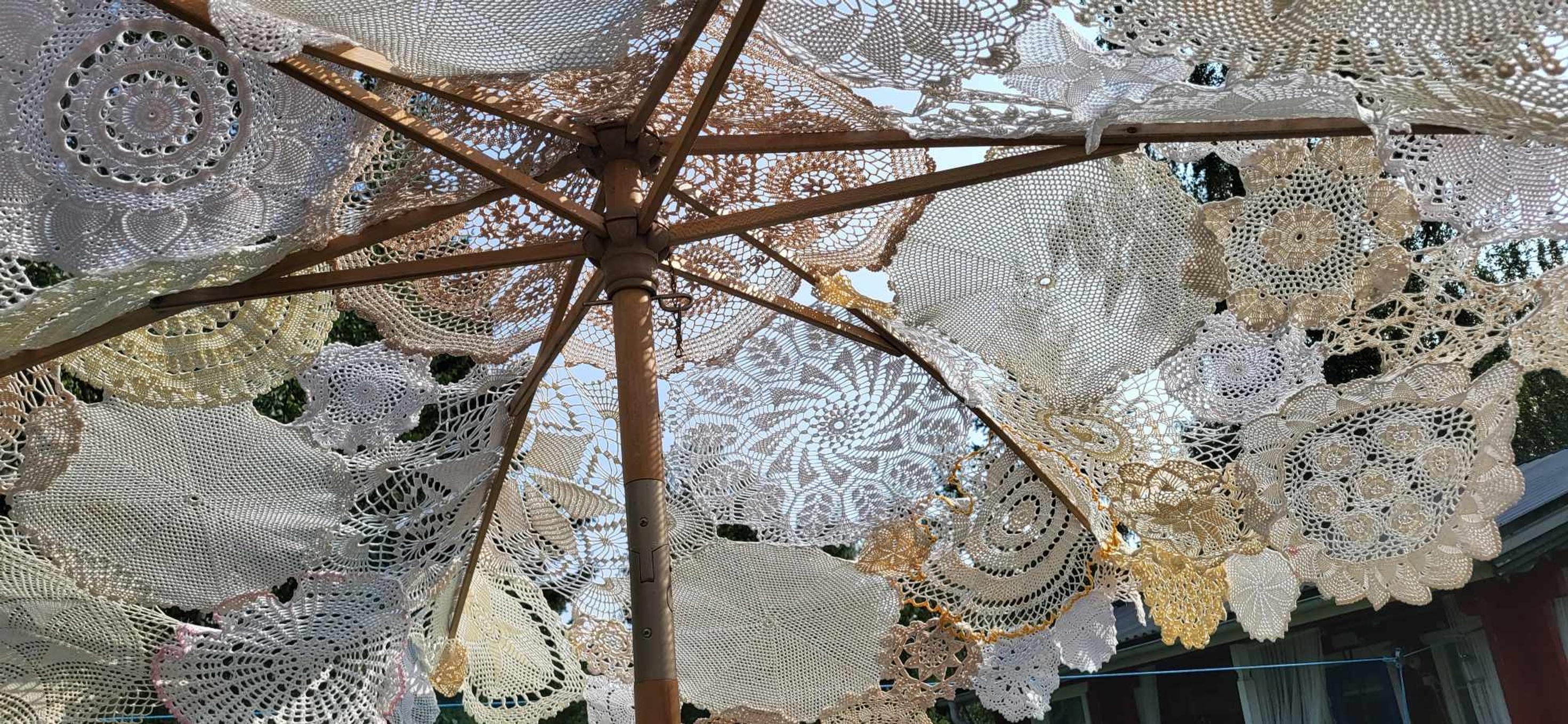 The wooden-framed umbrella exudes an old-time feel, especially since its surface is made up of numerous lace doilies. Photo Soile Björklund