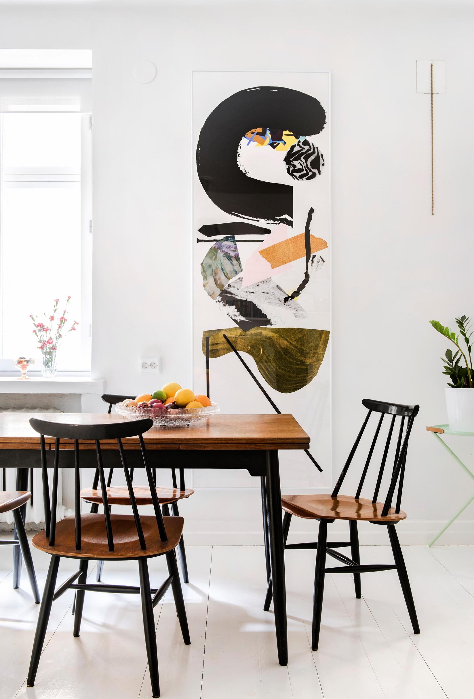 Dark spindle-back chairs and a dining table