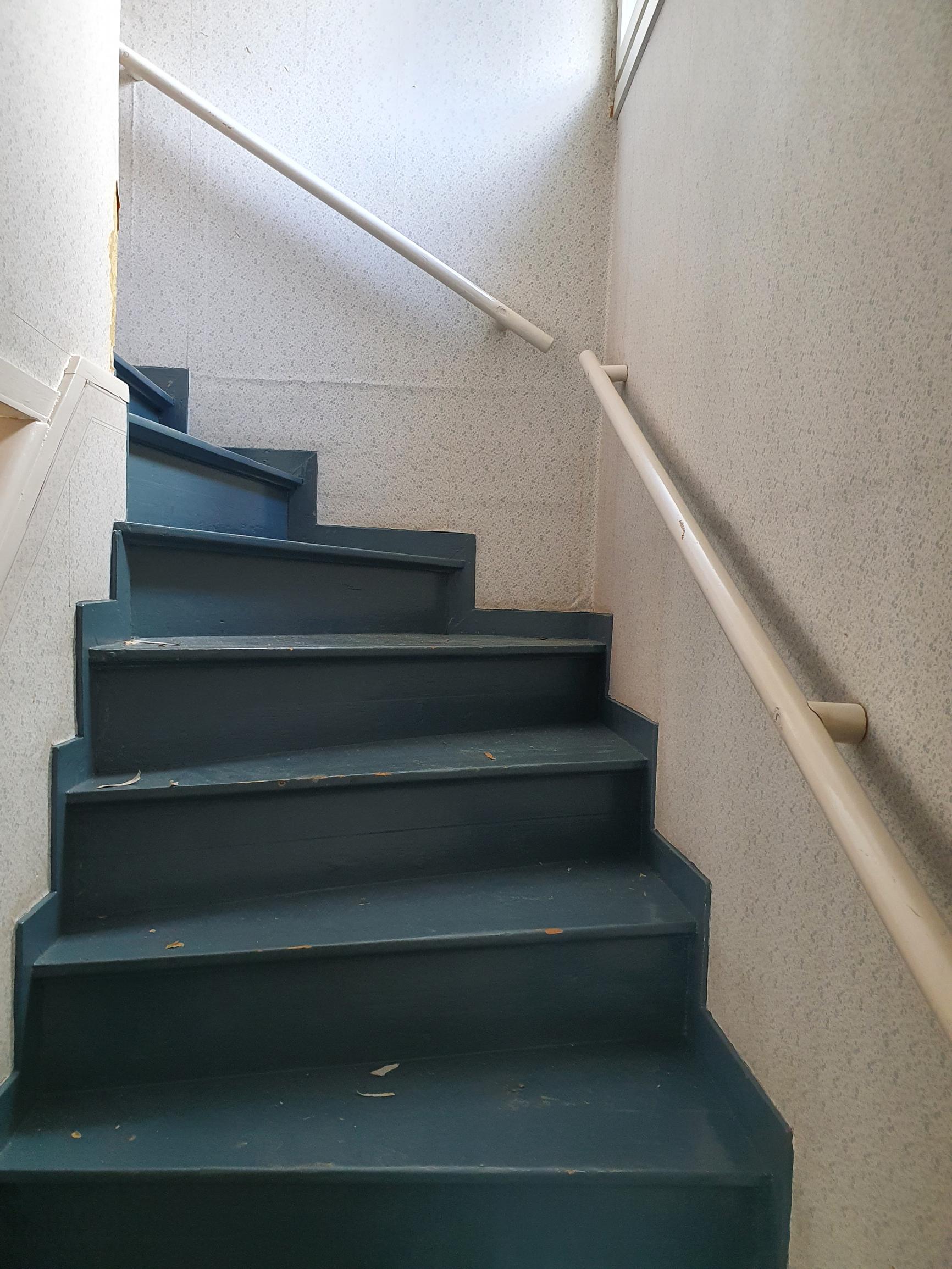 An unrenovated staircase.