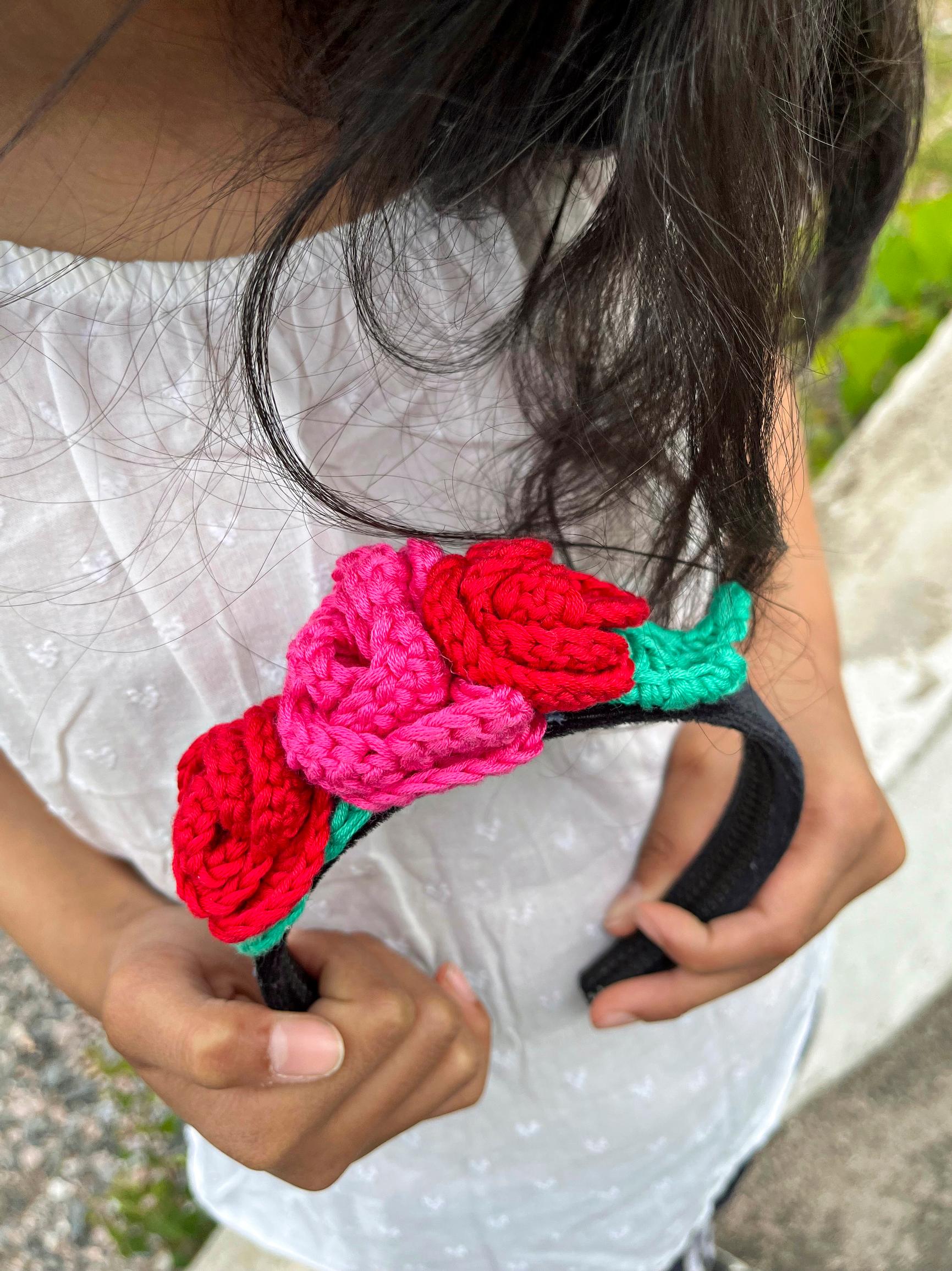 A crocheted rose headband for a kid—here’s how to customize it with flowers