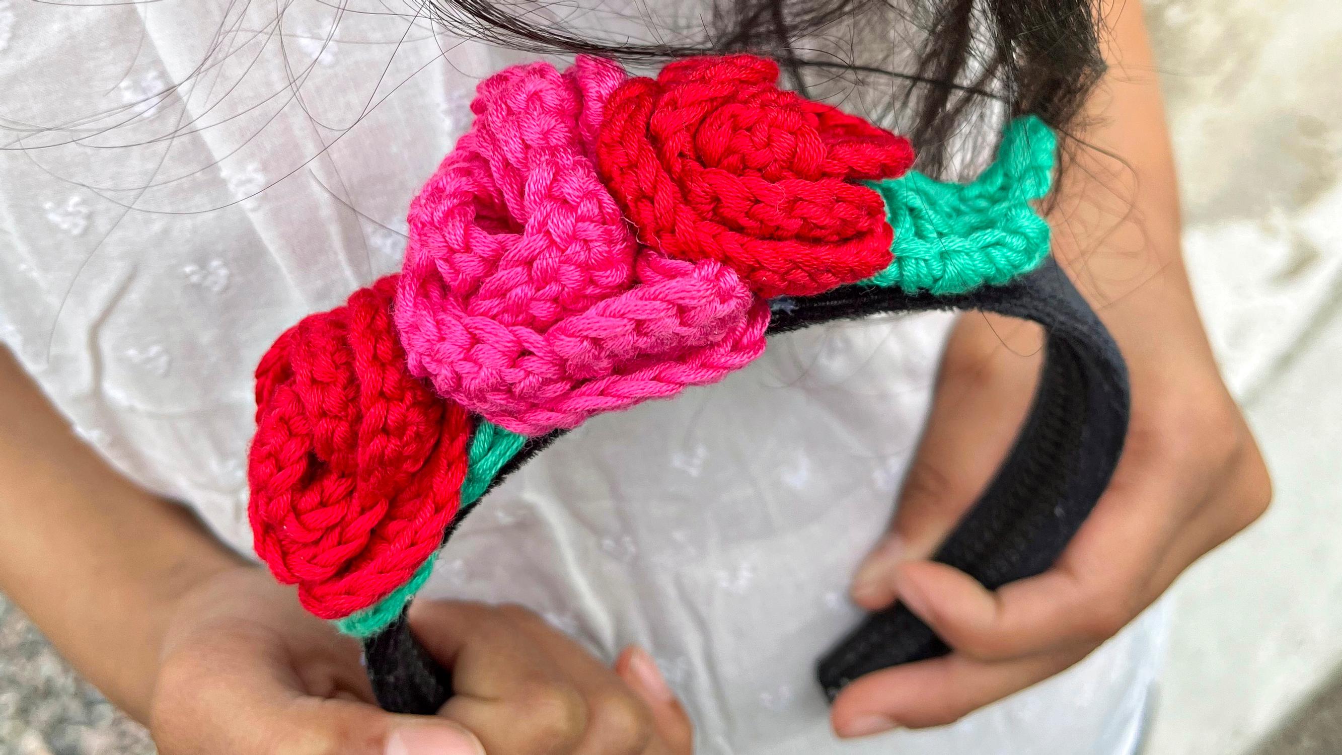 A crocheted rose headband for a kid—here’s how to customize it with flowers