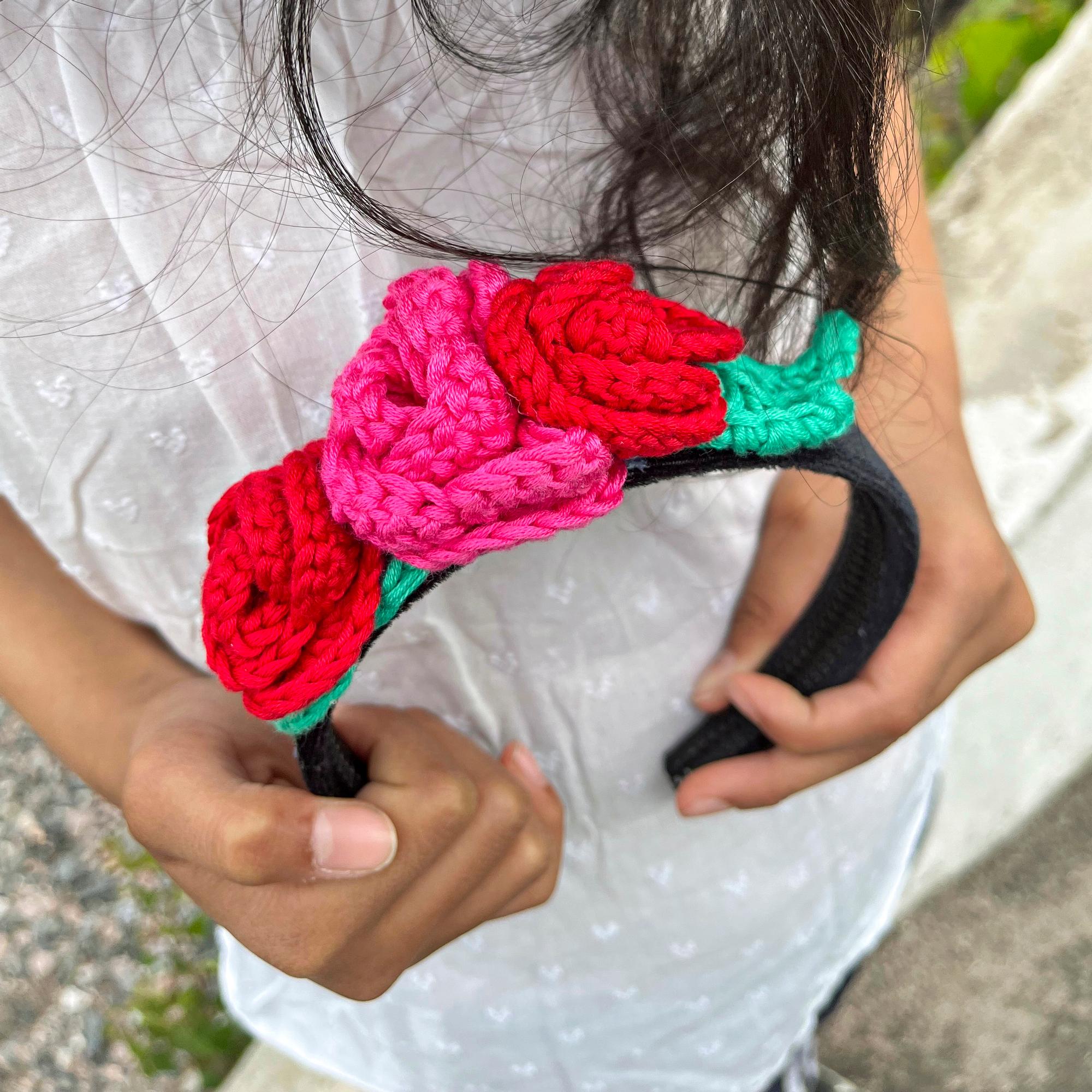 A crocheted rose headband for a kid—here’s how to customize it with flowers