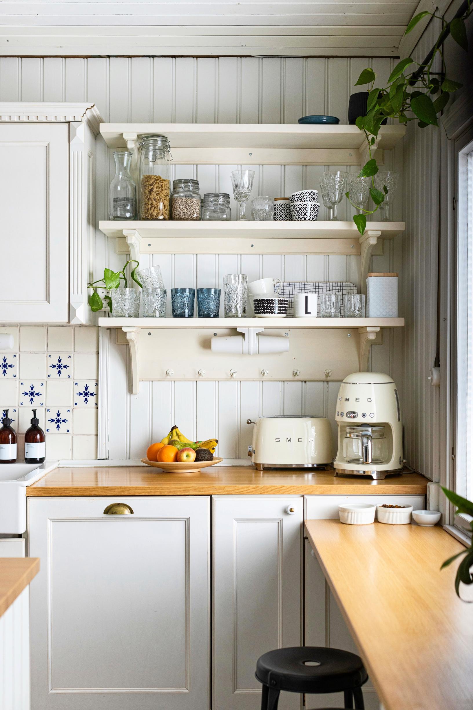 Open shelves in a white kitchen