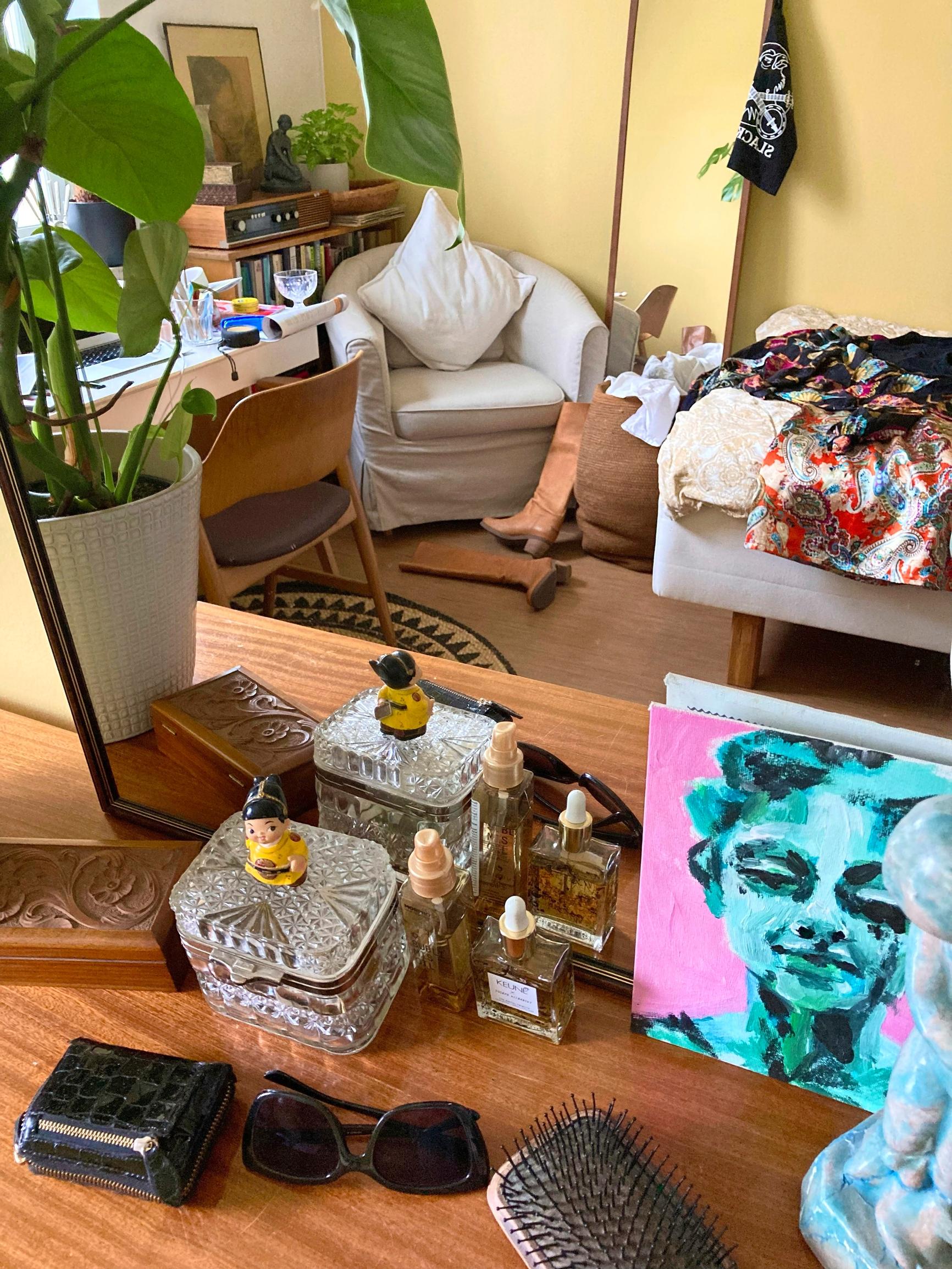 a bedroom with various items scattered around