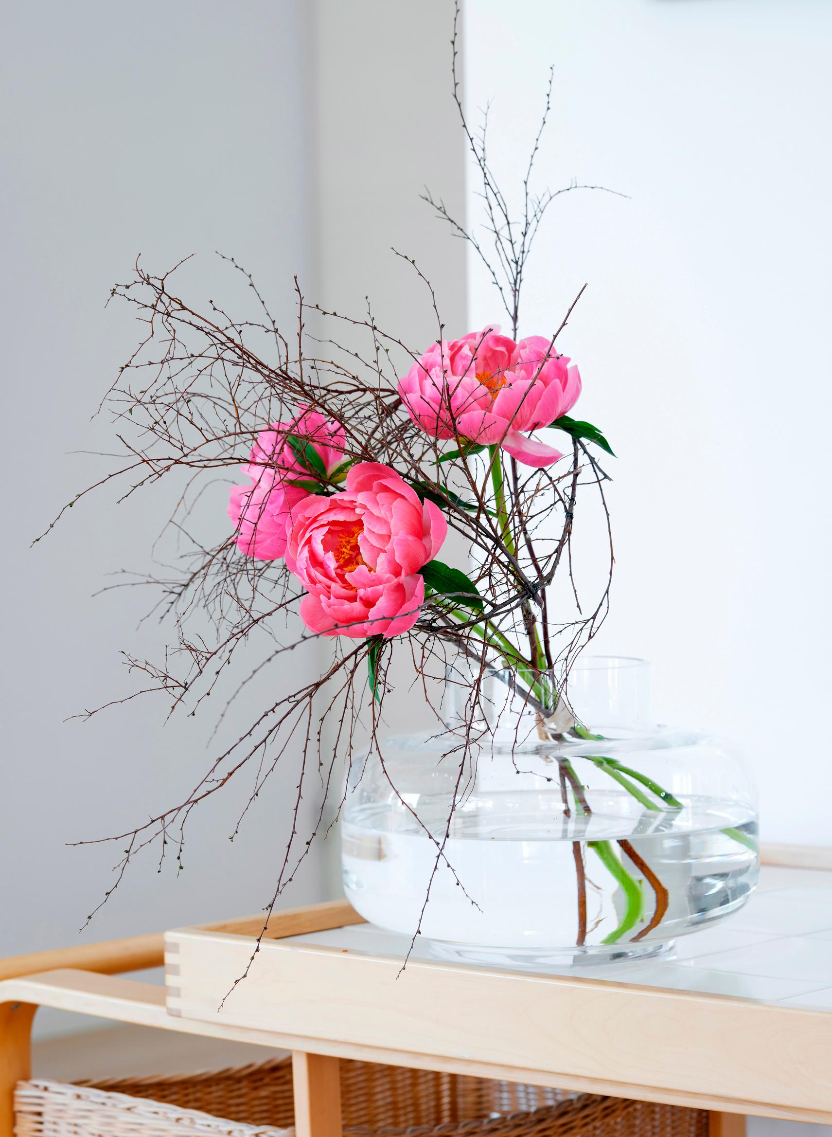 Peony flower arrangement made of peonies and twigs