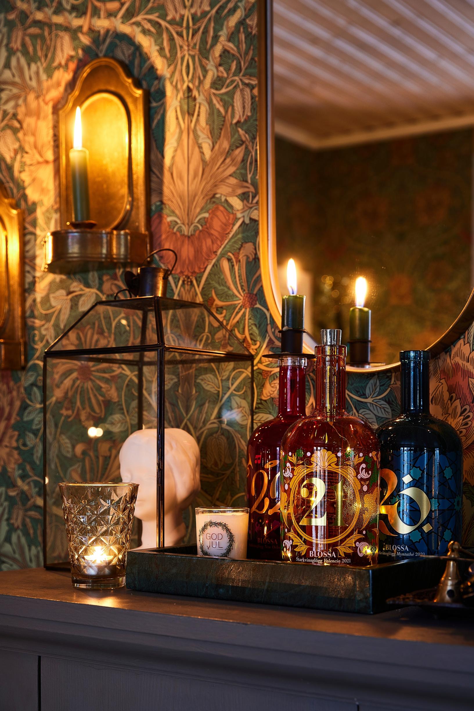 Old mulled wine bottles used as candleholders.