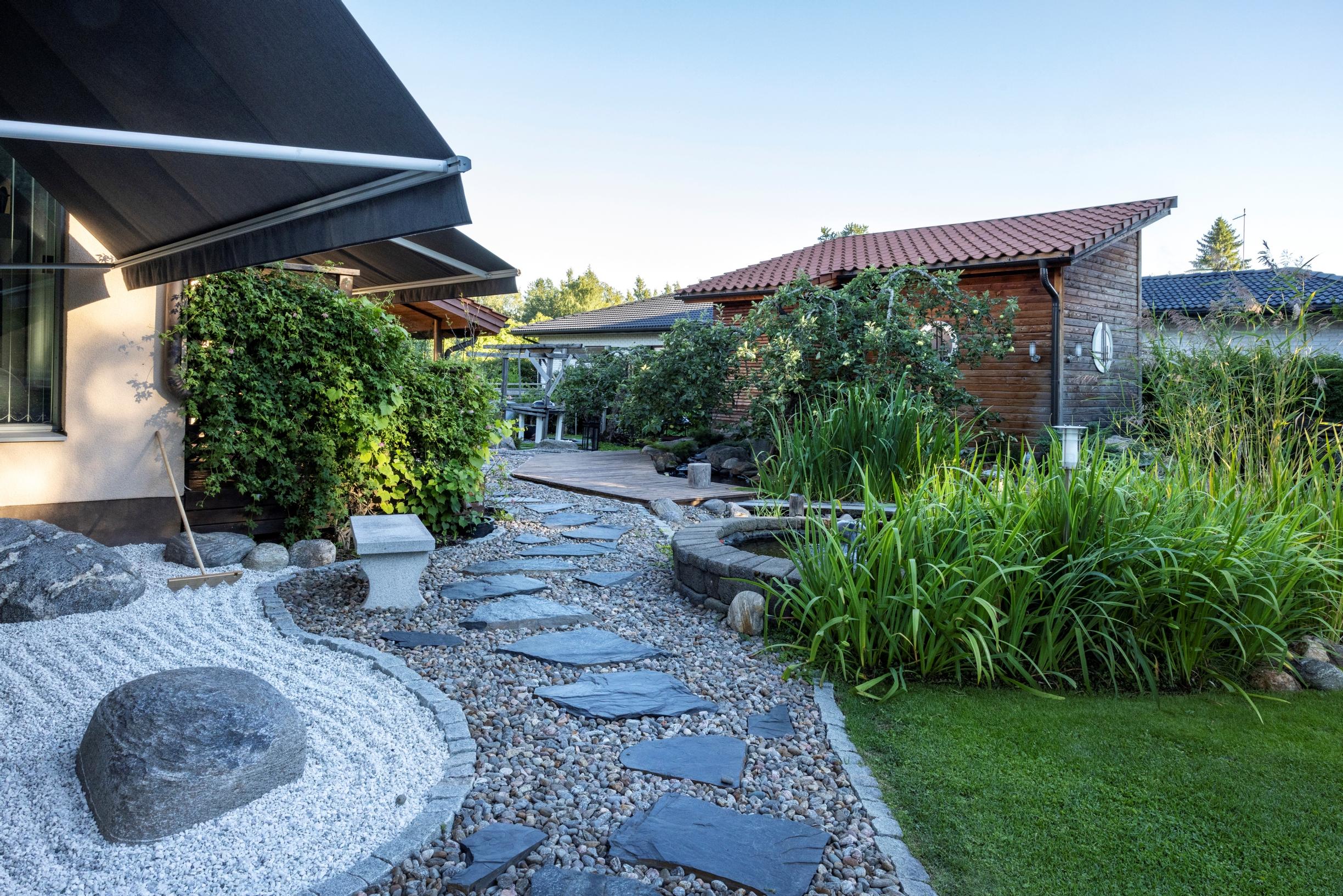 Stones are used as winding stepping stones and to symbolize water, islands, and mountains.