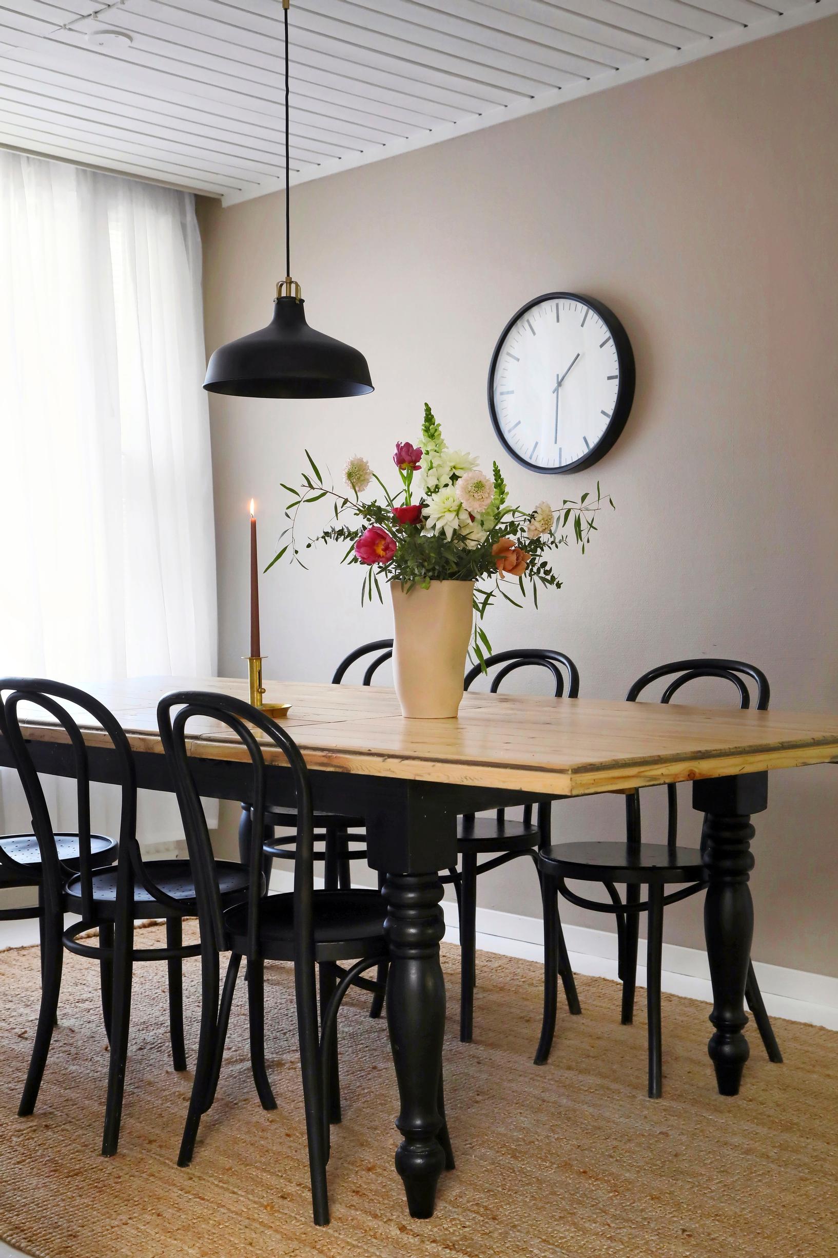 Photo of the refurbished dining table and bentwood chairs.