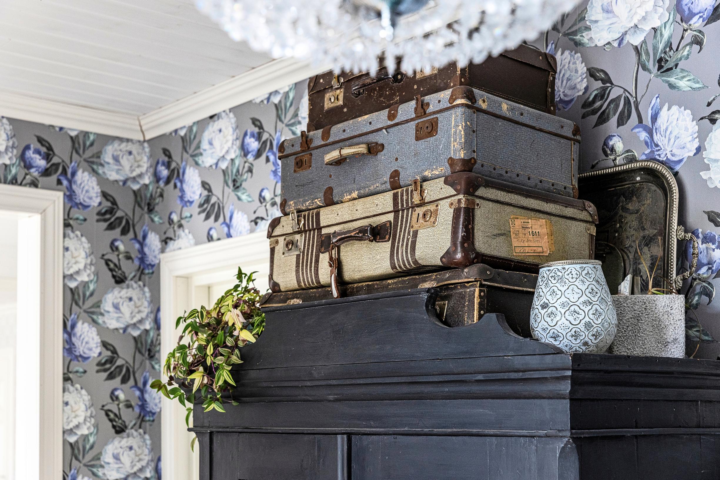 Suitcases on top of a wardrobe