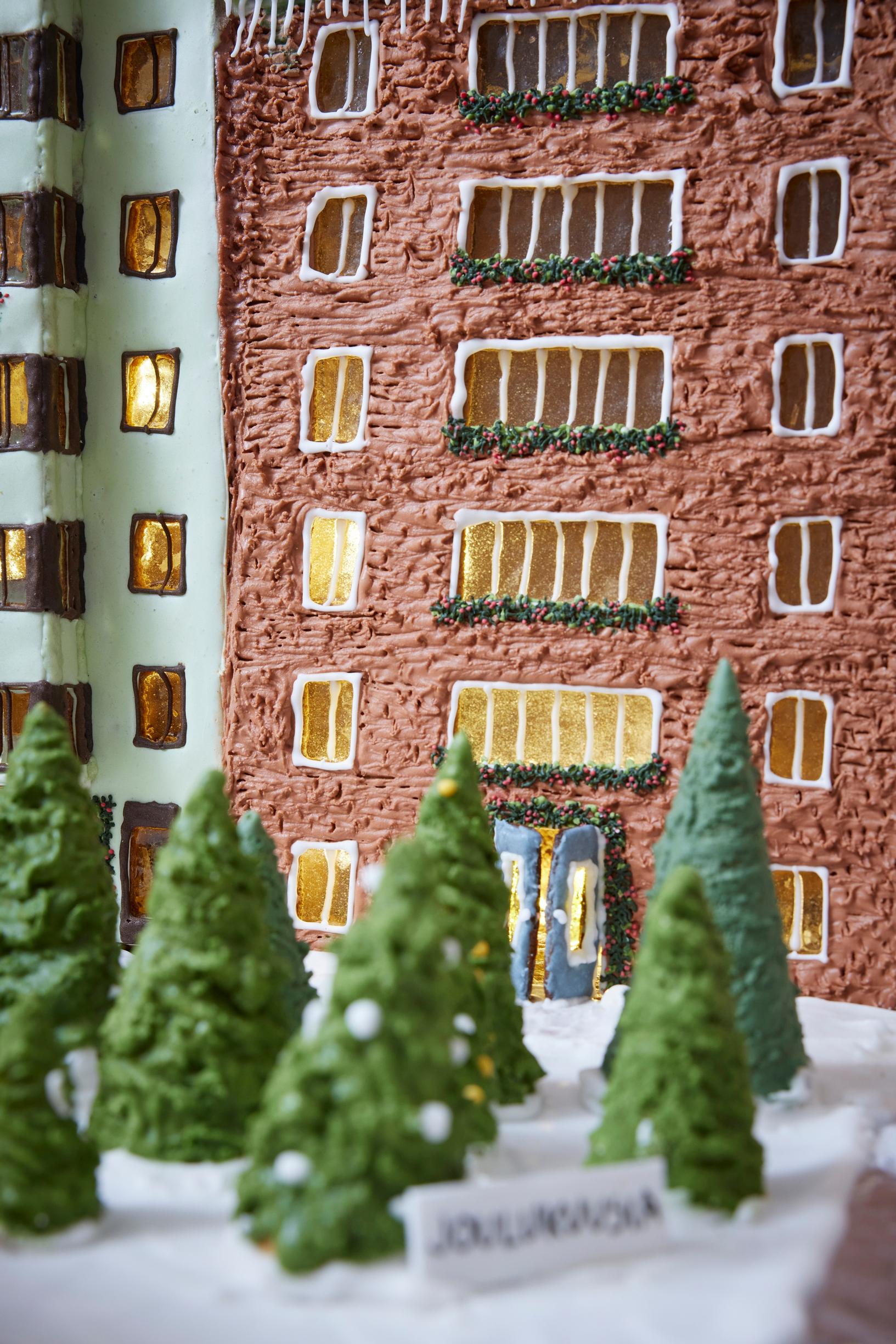 An “brick-patterned” apartment building made of gingerbread.