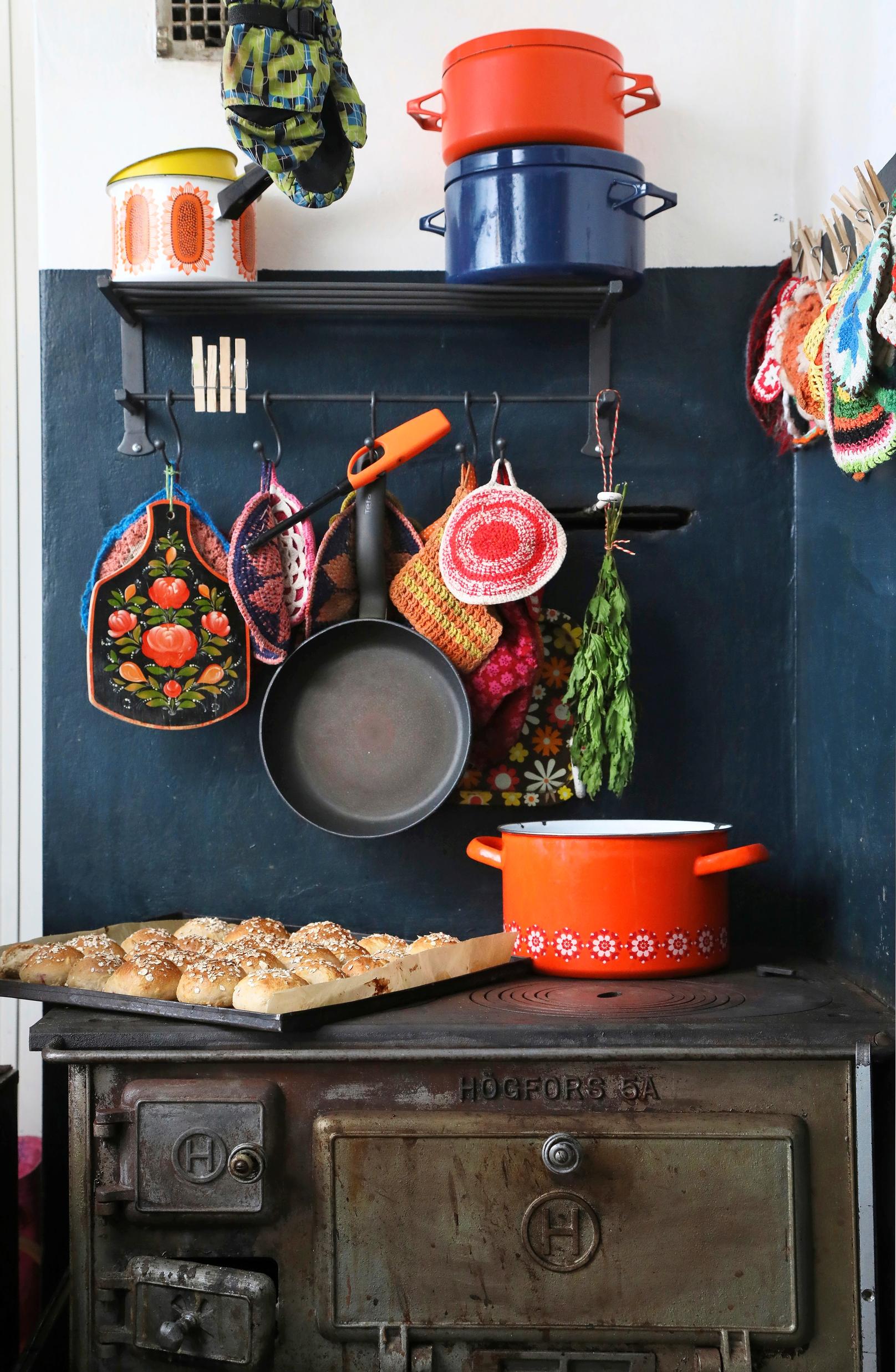 A wood stove and enamel pots.