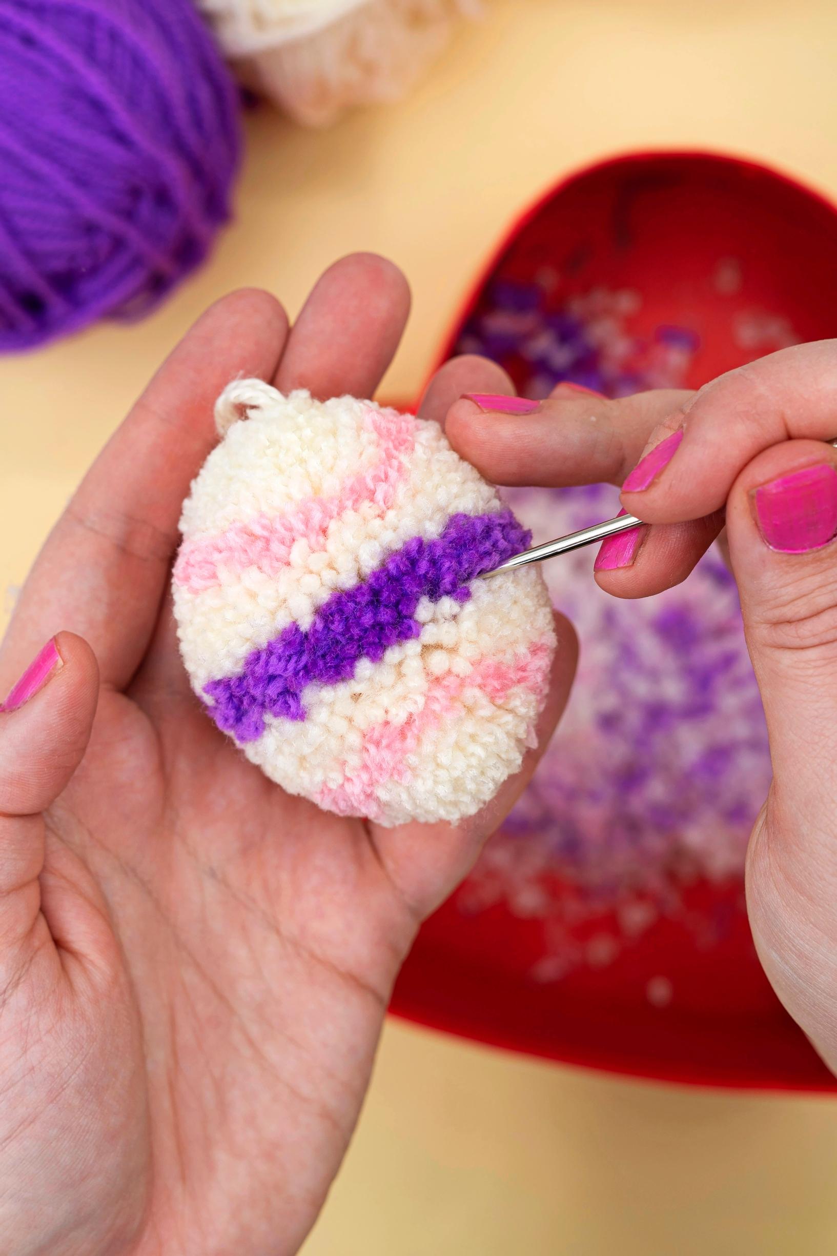 finishing a pompom egg