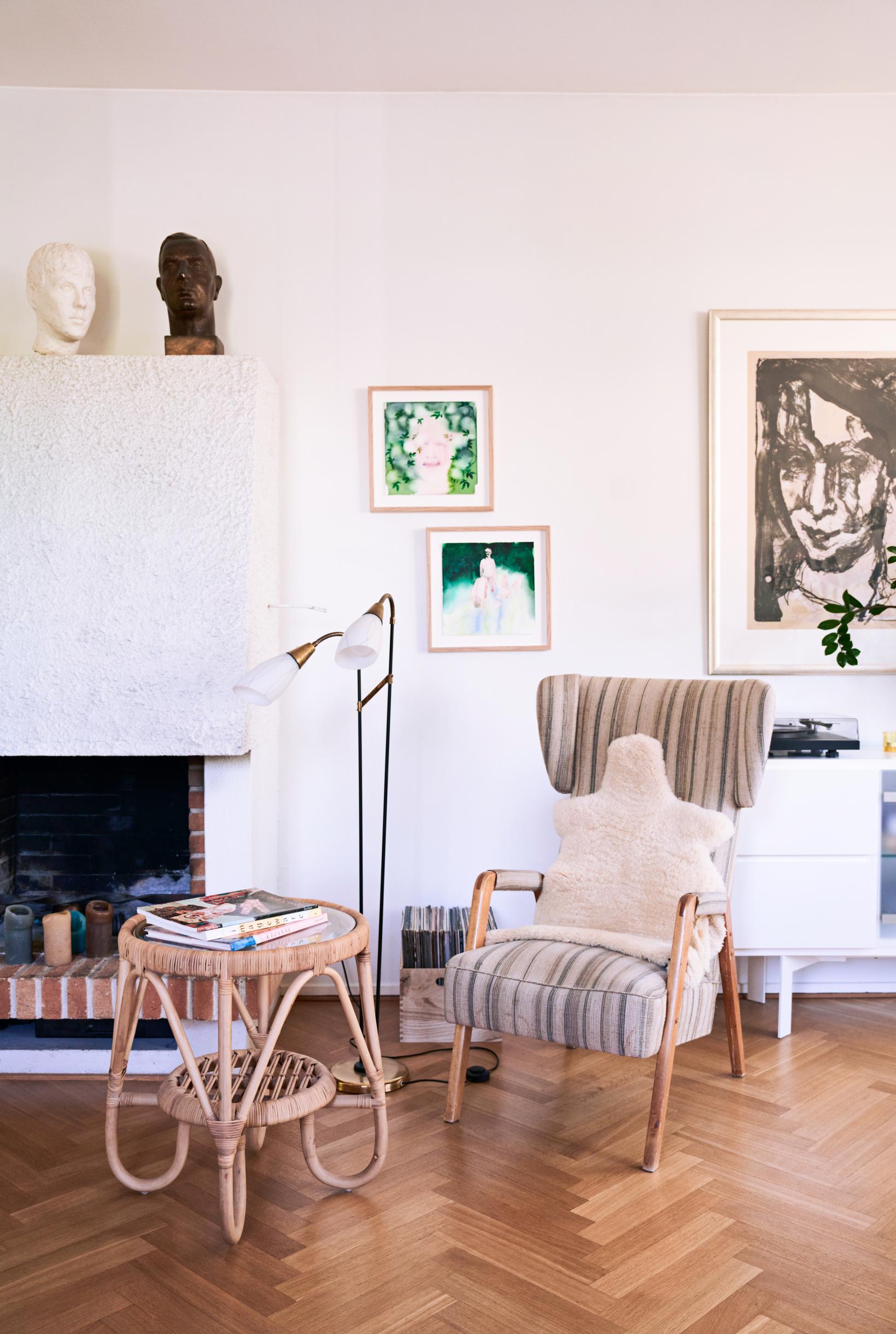Photo of a seating area by the fireplace.