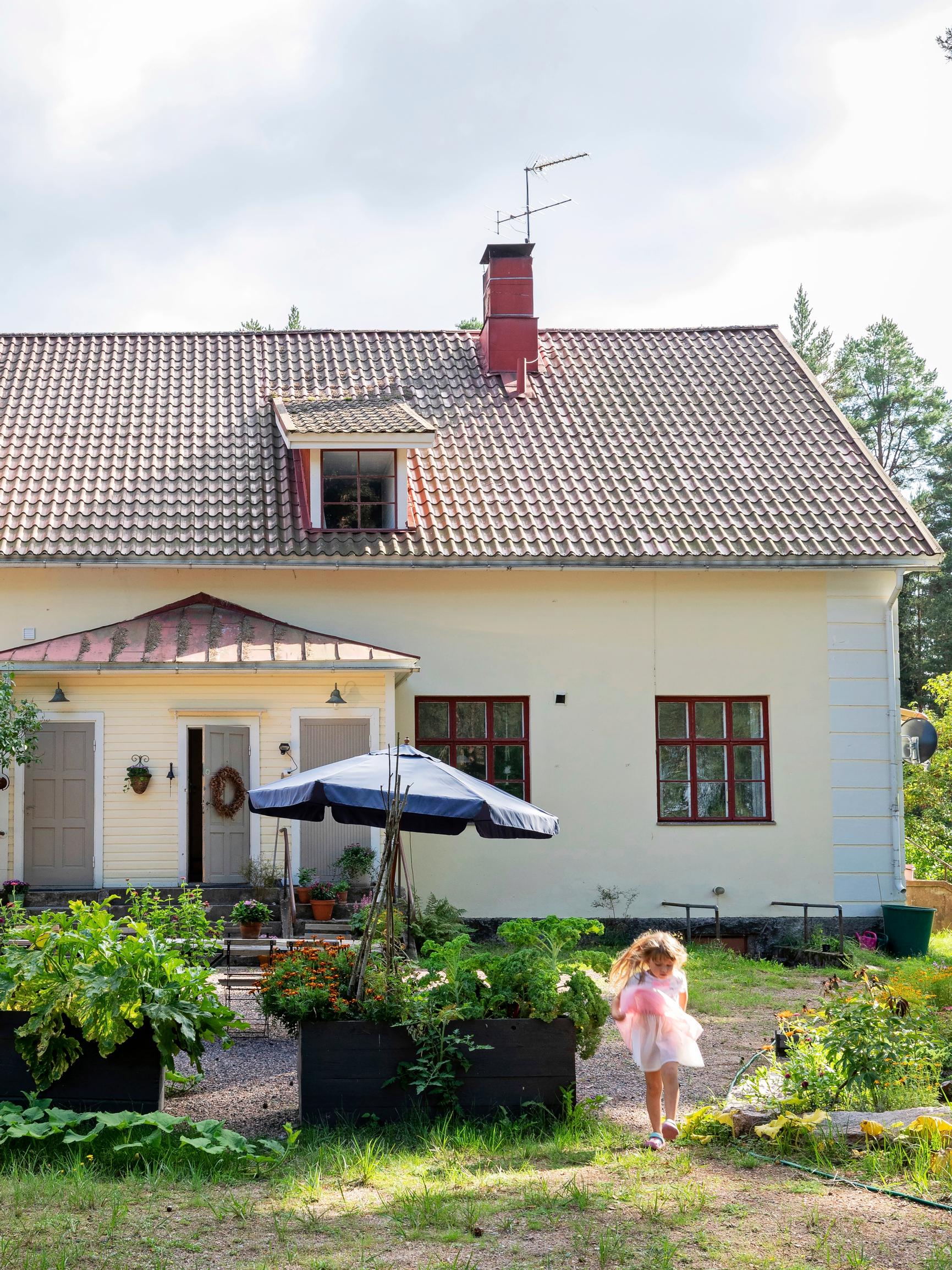 An “enormous” old village school turned into a family home with enchanting windows, wooden floors, and 600 square meters