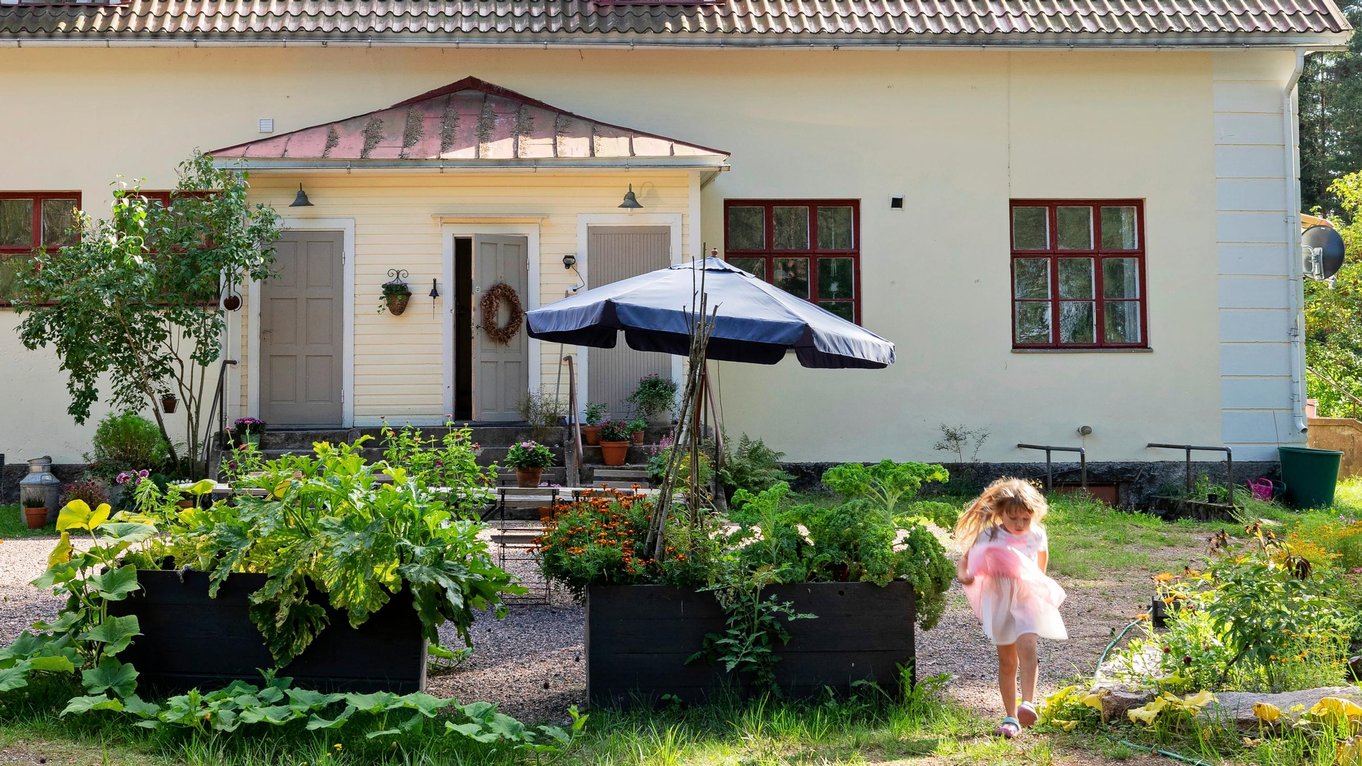An “enormous” old village school turned into a family home with enchanting windows, wooden floors, and 600 square meters