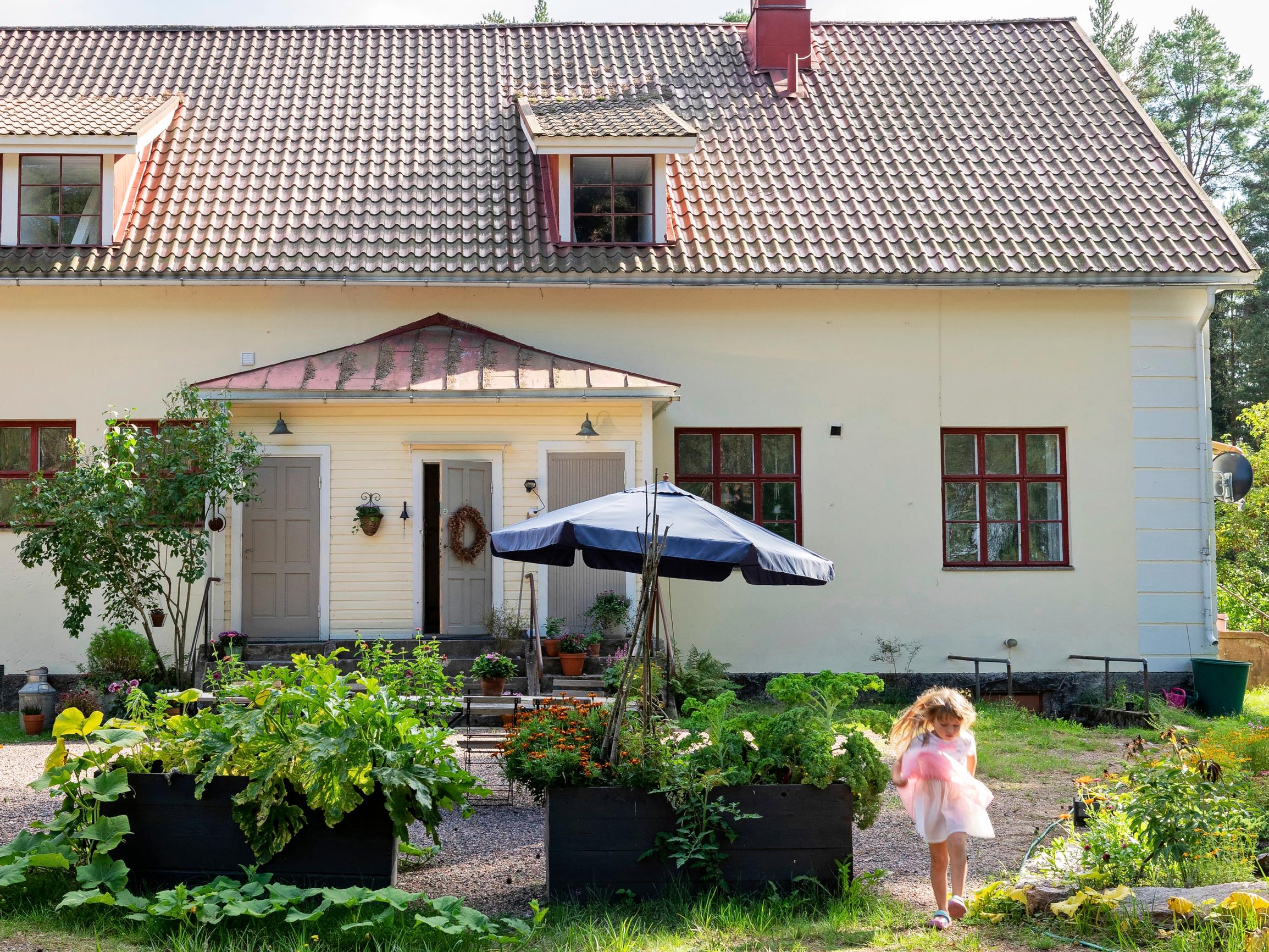 An “enormous” old village school turned into a family home with enchanting windows, wooden floors, and 600 square meters