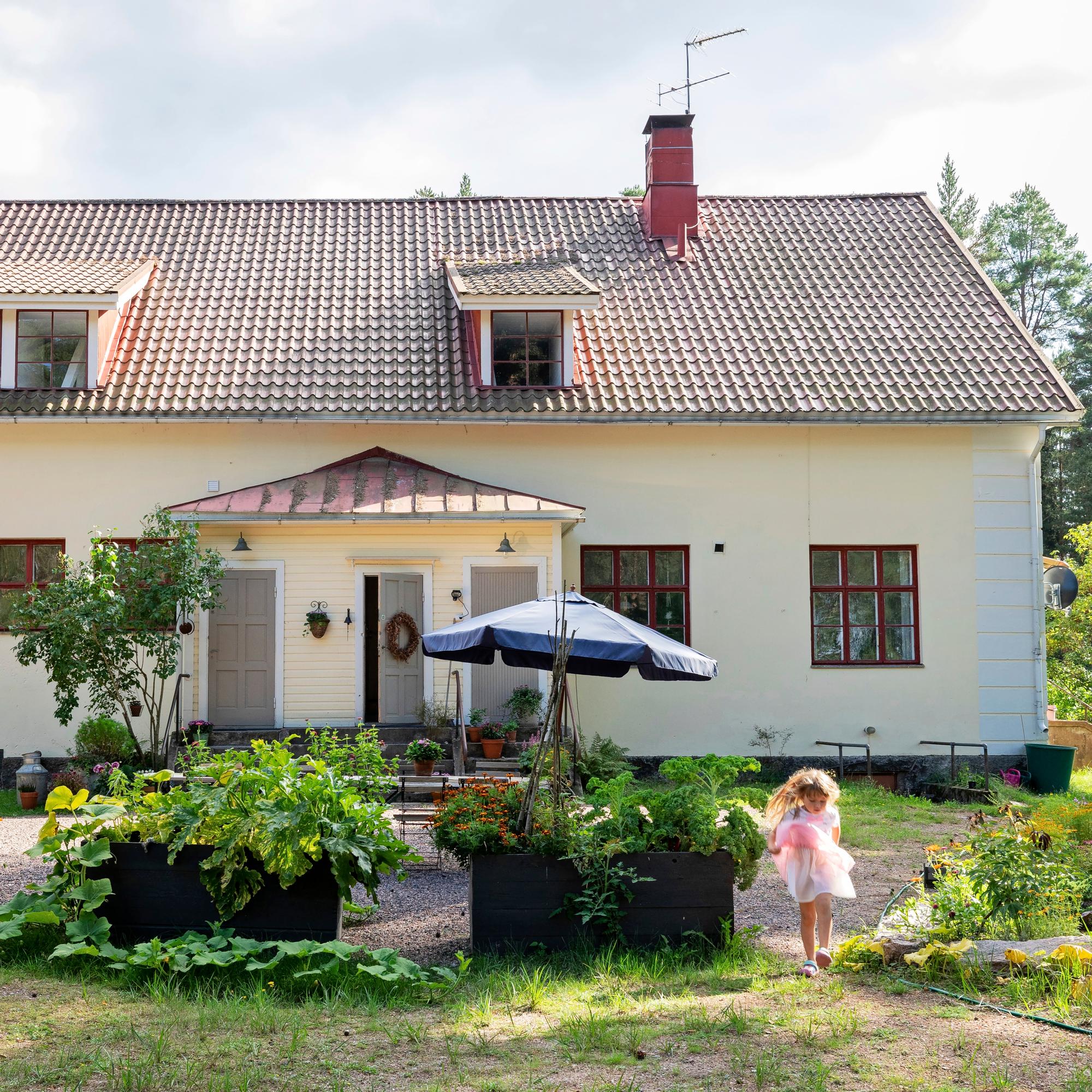 An “enormous” old village school turned into a family home with enchanting windows, wooden floors, and 600 square meters