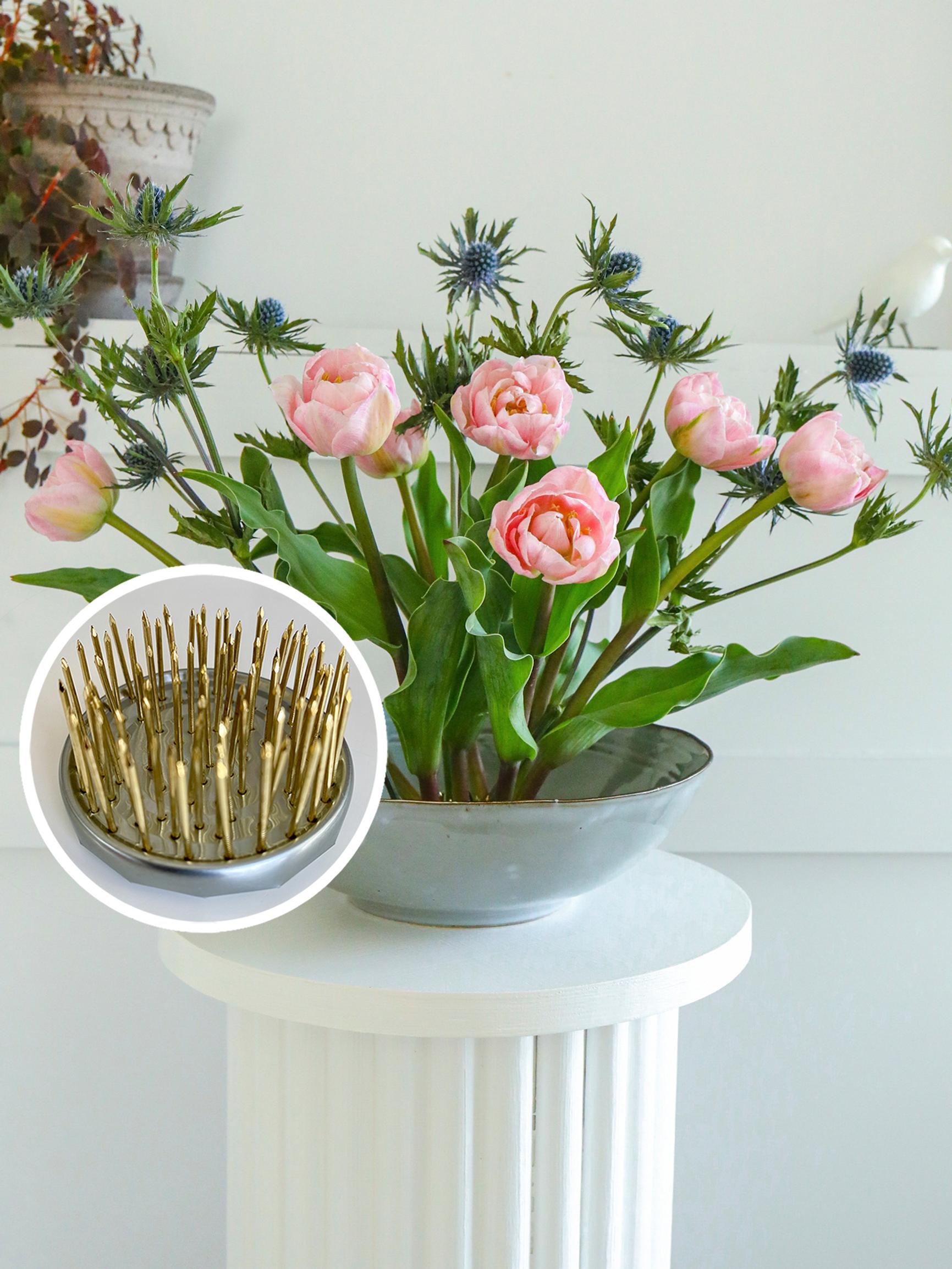 A pin frog is a great help when arranging flowers—make your own from a tin can!