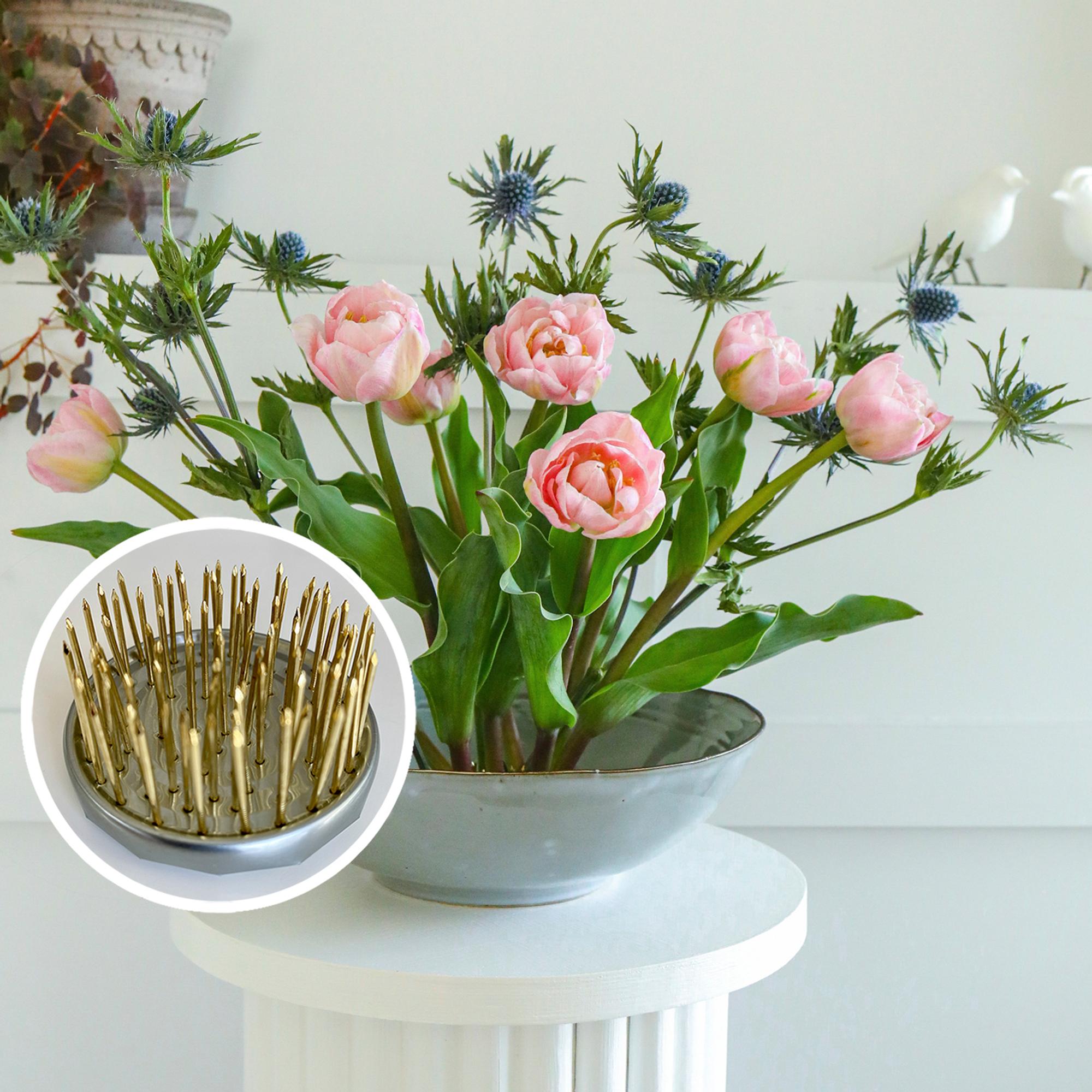 A pin frog is a great help when arranging flowers—make your own from a tin can!