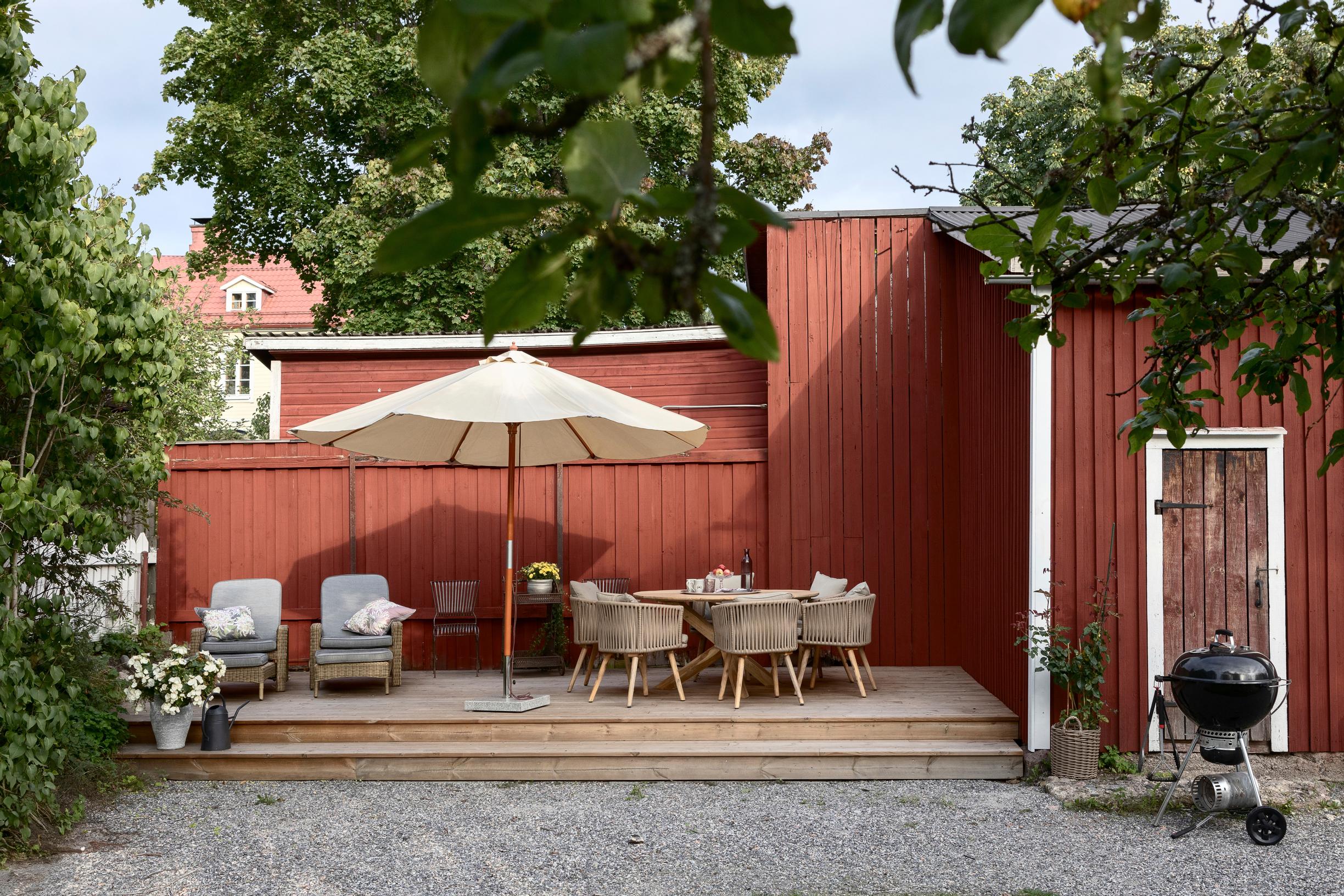 terrace next to a red wooden fence