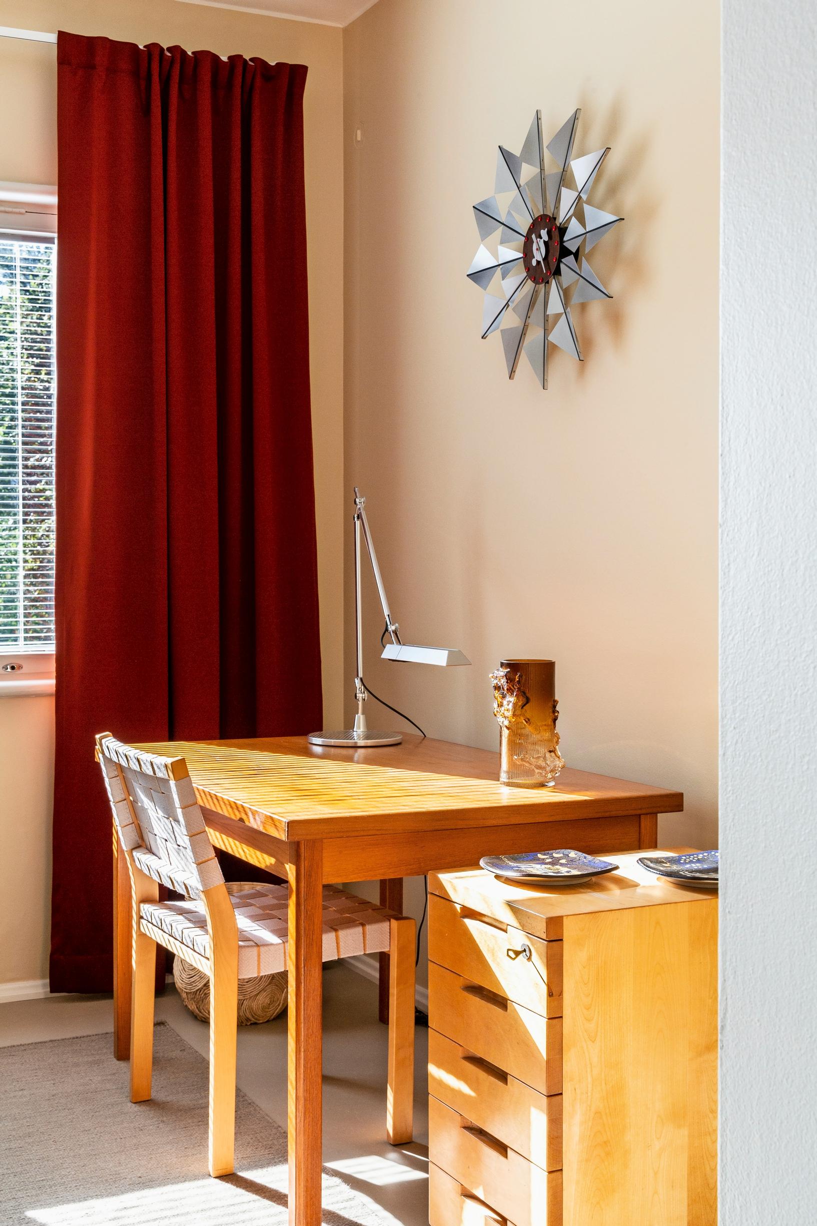 A workspace with an inherited table and an Artek chest of drawers