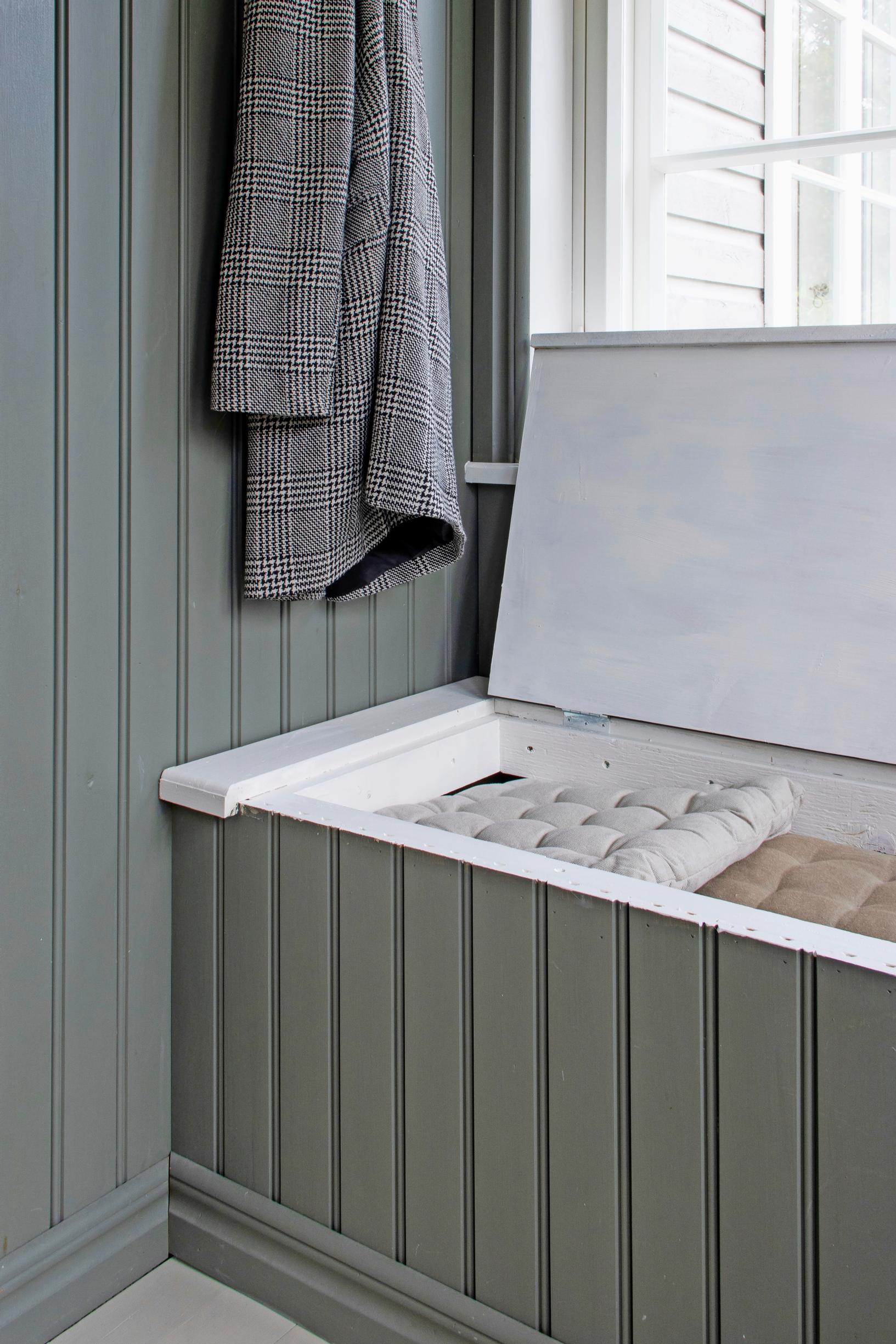 Photo of the built-in porch bench with the lid open.