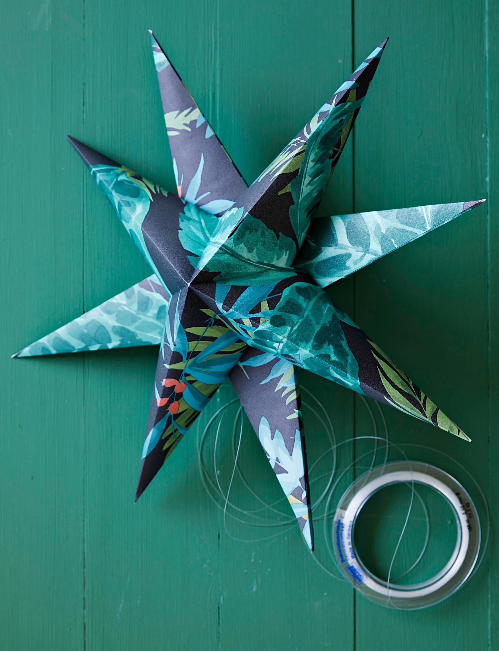 Finished paper Christmas star hanging in the window